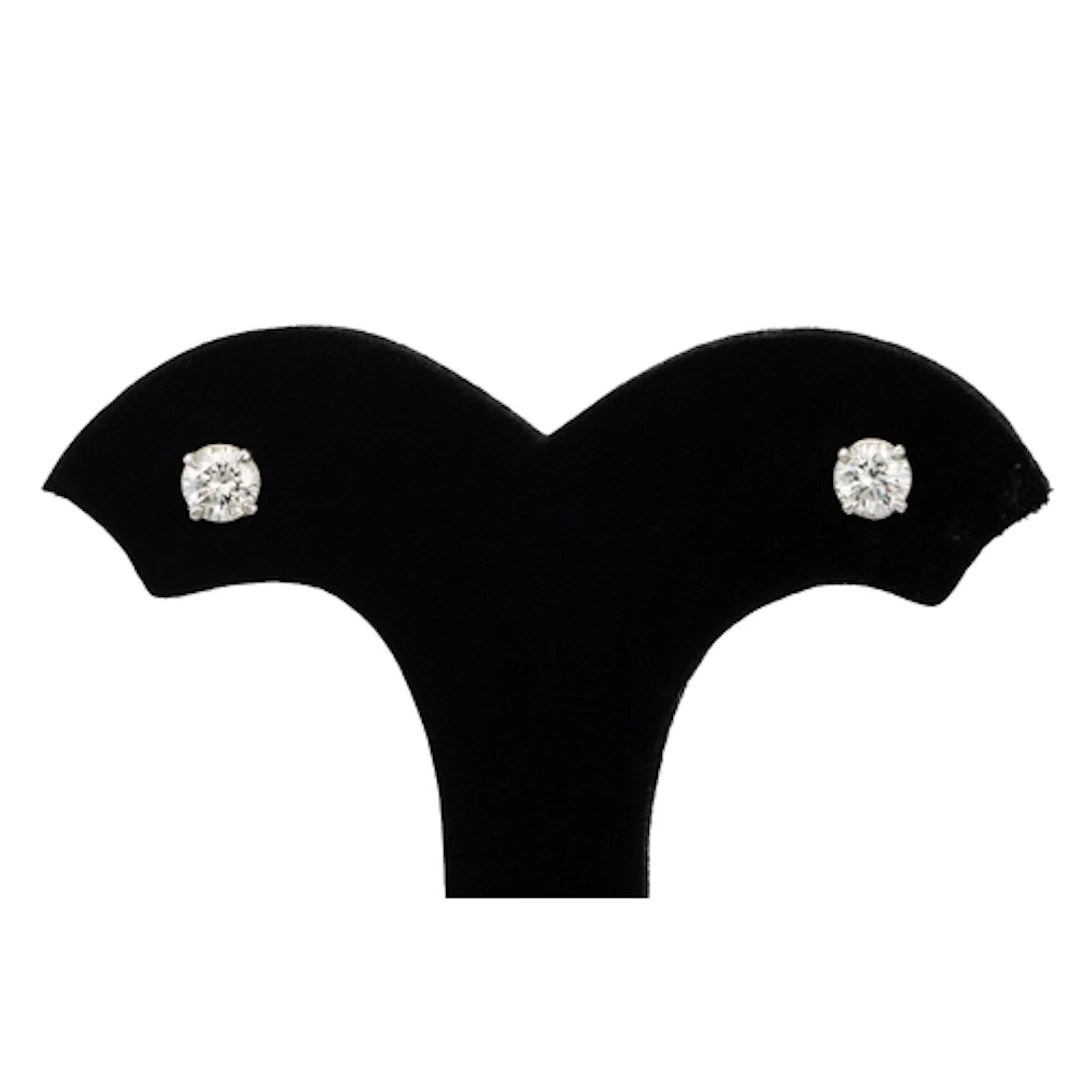A PAIR OF DIAMOND STUD EARRINGS, the brilliant cut diamonds ...