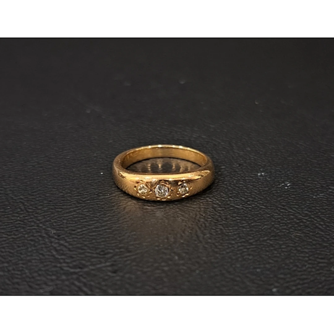 FLUSH SET DIAMOND RING in nine carat gold, the diamonds tota...