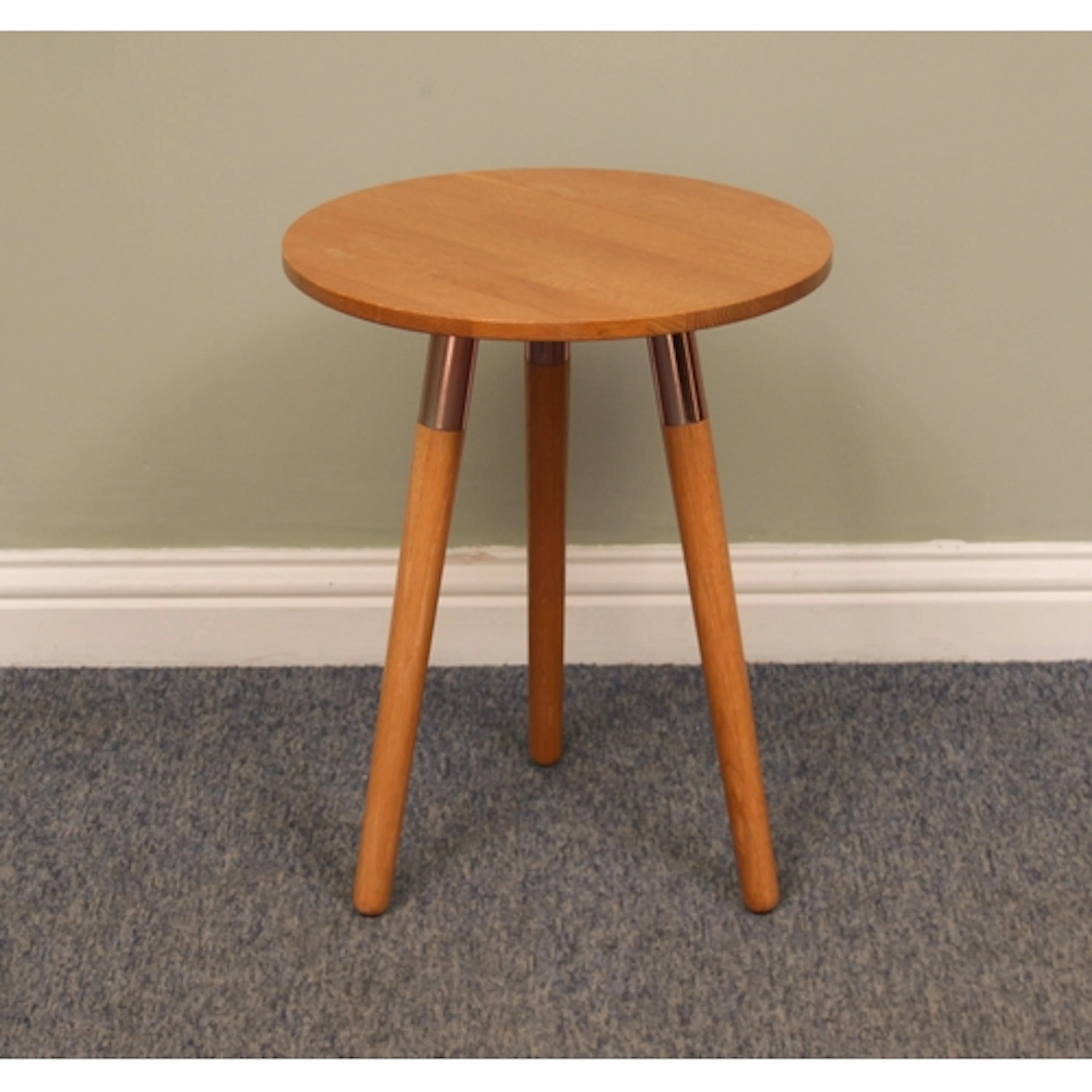 A light oak tripod drinks table by Made.com - the circular t...
