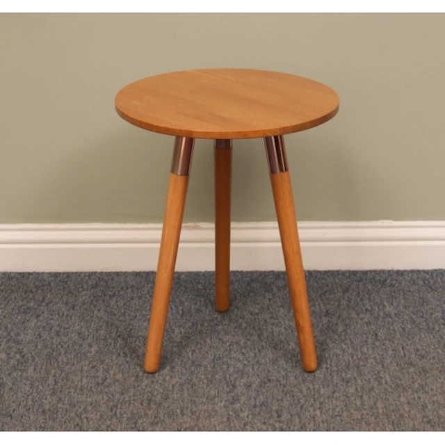 A light oak tripod drinks table by Made.com - the circular t...