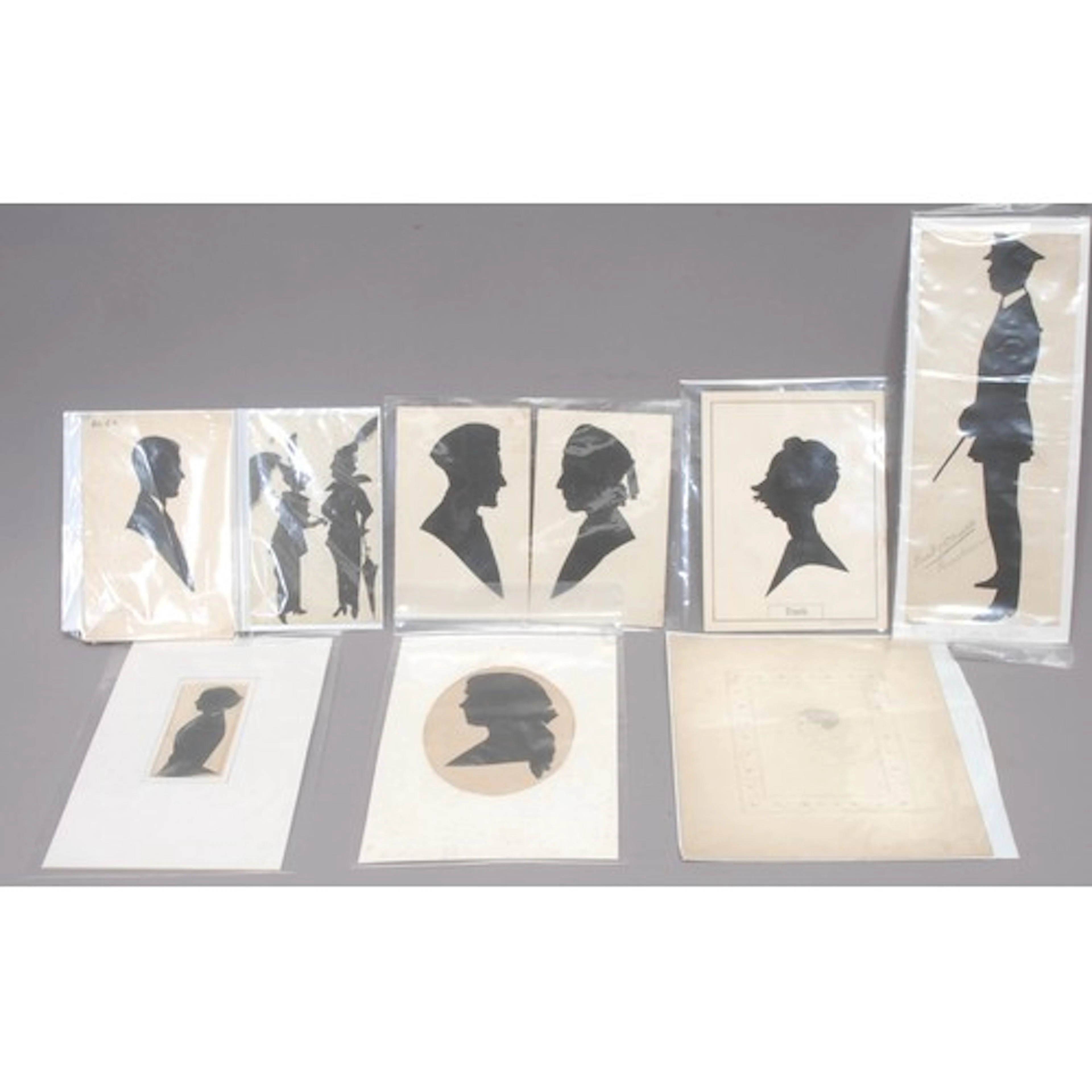 Silhouettes - Arthur Forrester (early 20th century), a pair,...