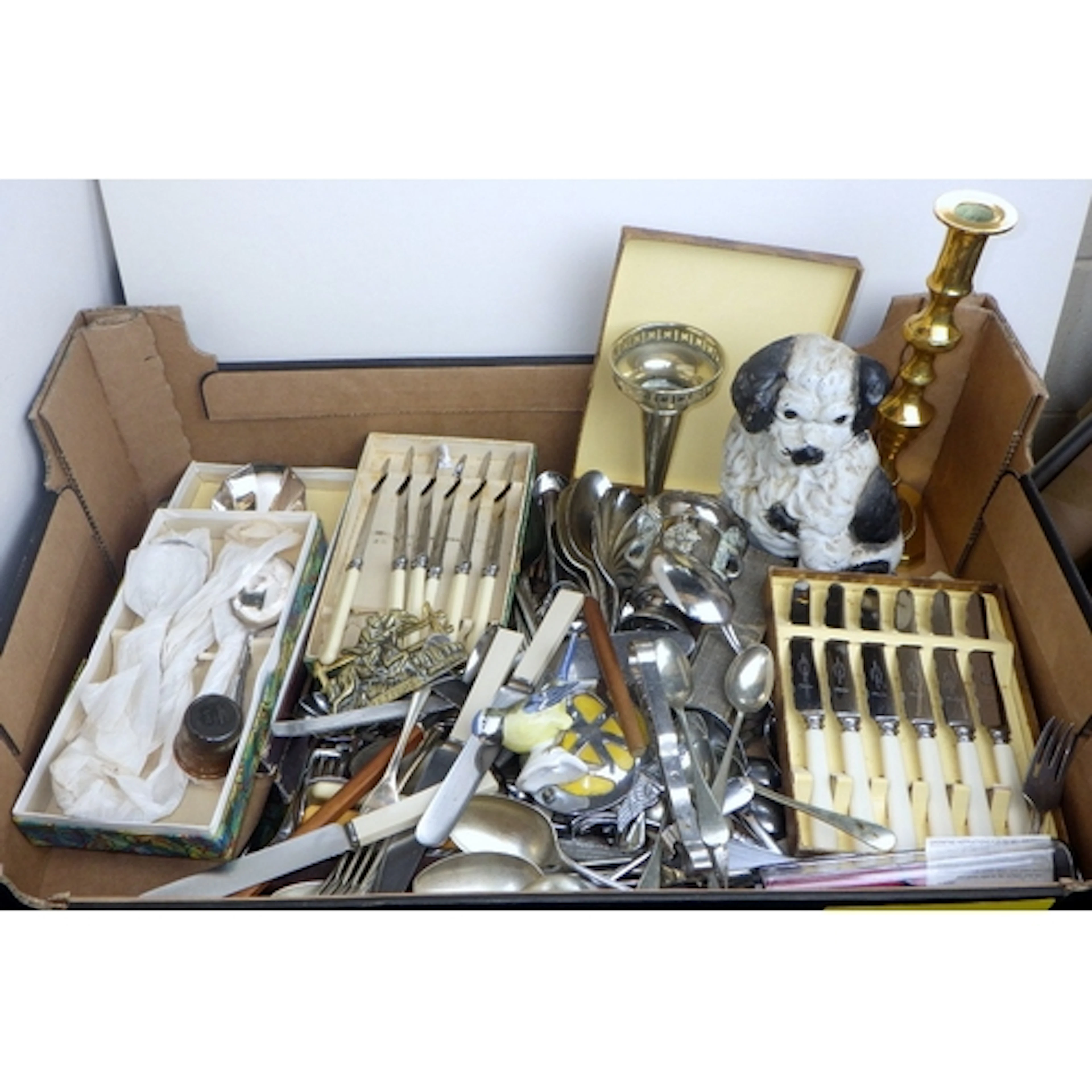 A qty of cutlery, cast door stop etc