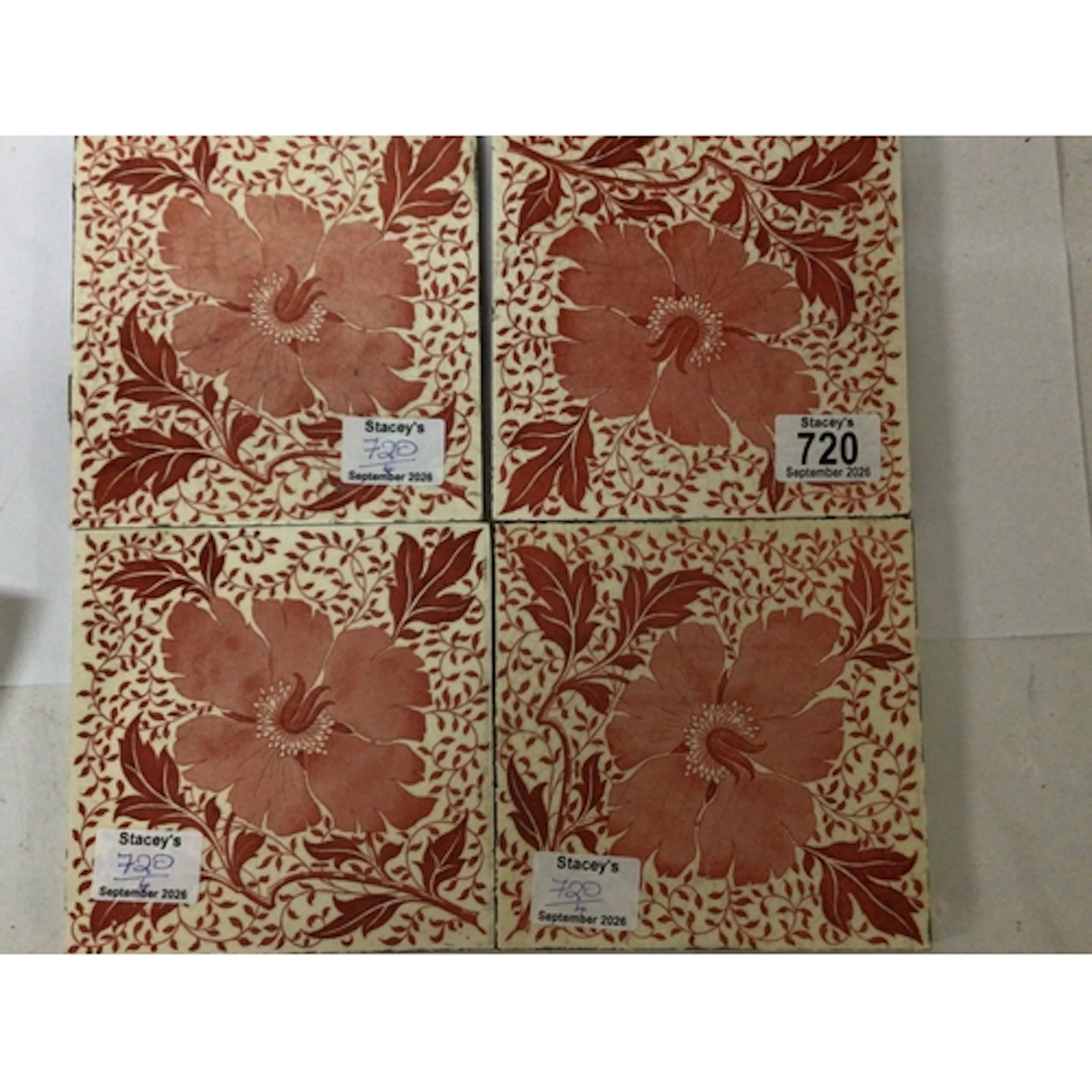 A set of four Minton Victorian tiles decorated in red ...