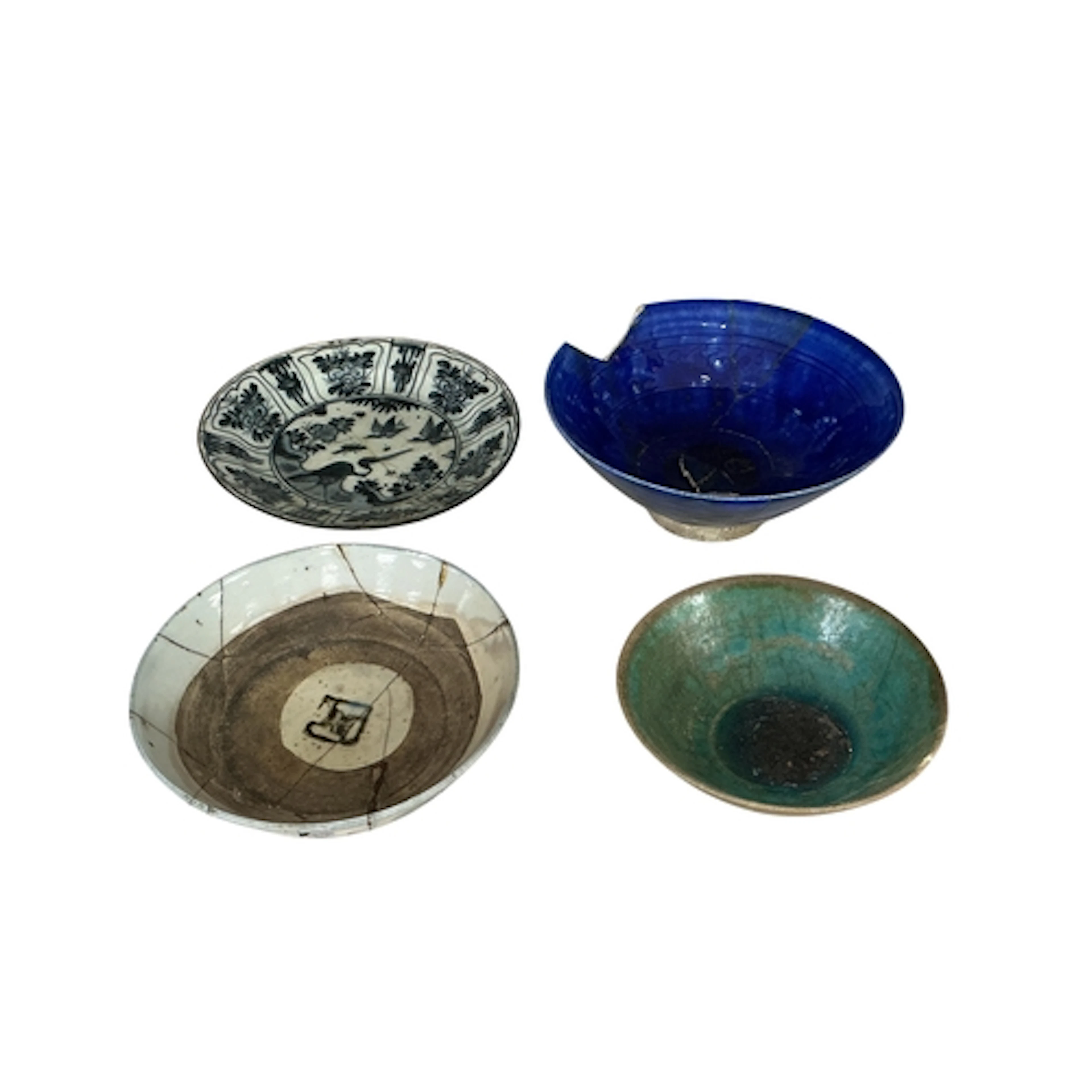 Two 13th/14th century Kashan pottery bowls, a Safavid Blue a...