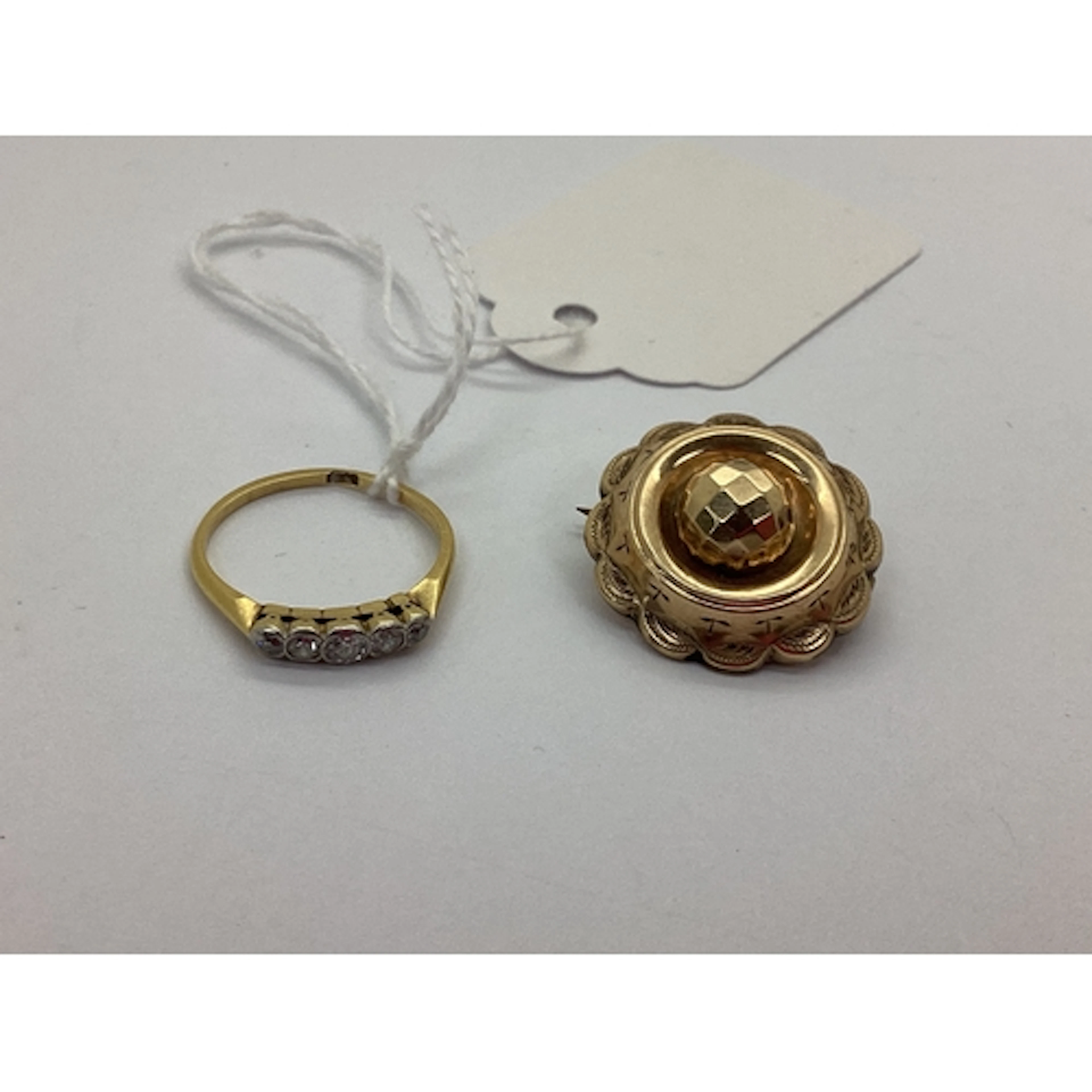 An Antique Circular Brooch, with faceted dome centre, within...