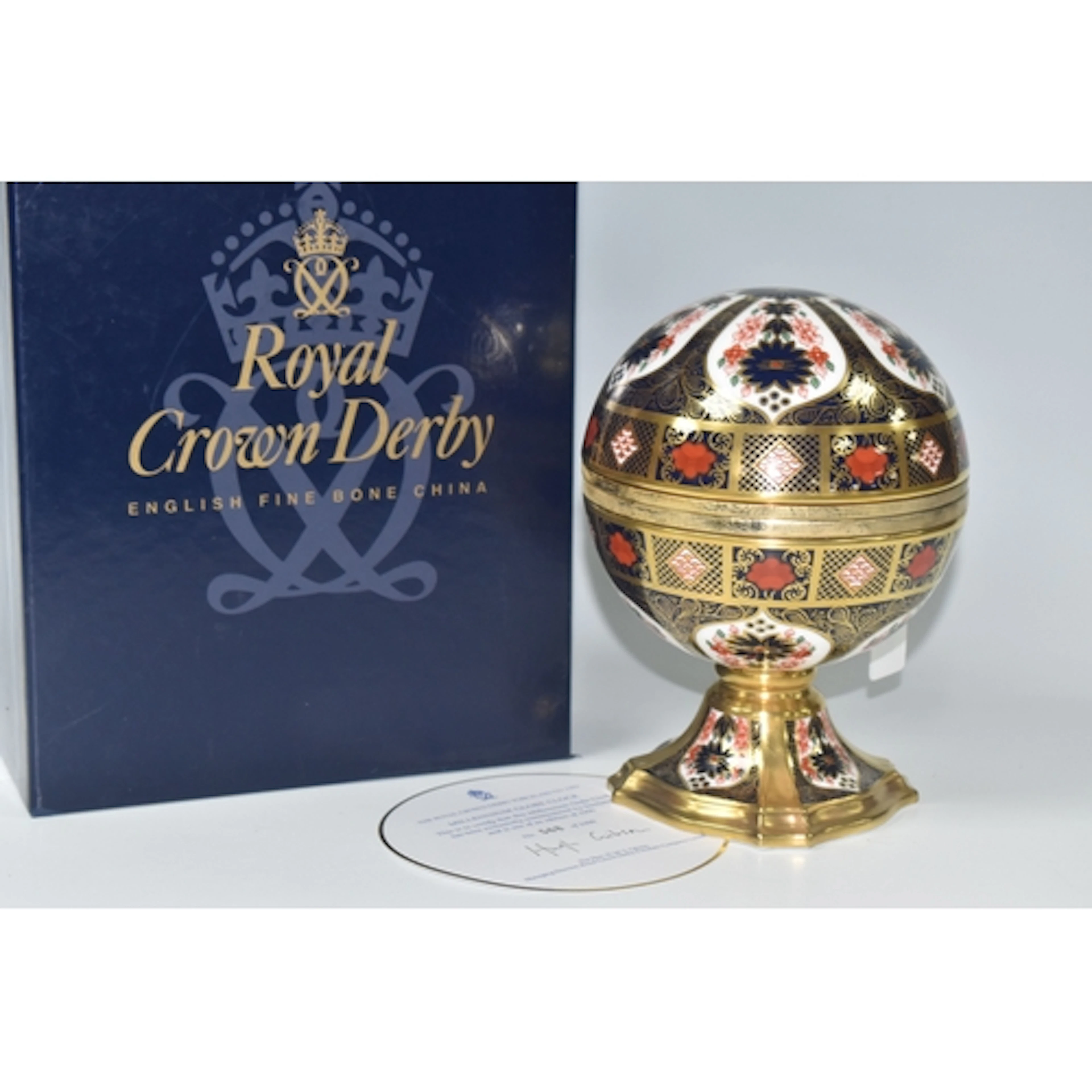 A BOXED ROYAL CROWN DERBY MILLENNIUM GLOBE CLOCK, in Imari 1...