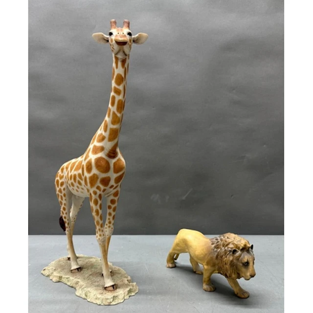 A Coalport figure of a lion together with a plaster figure o...