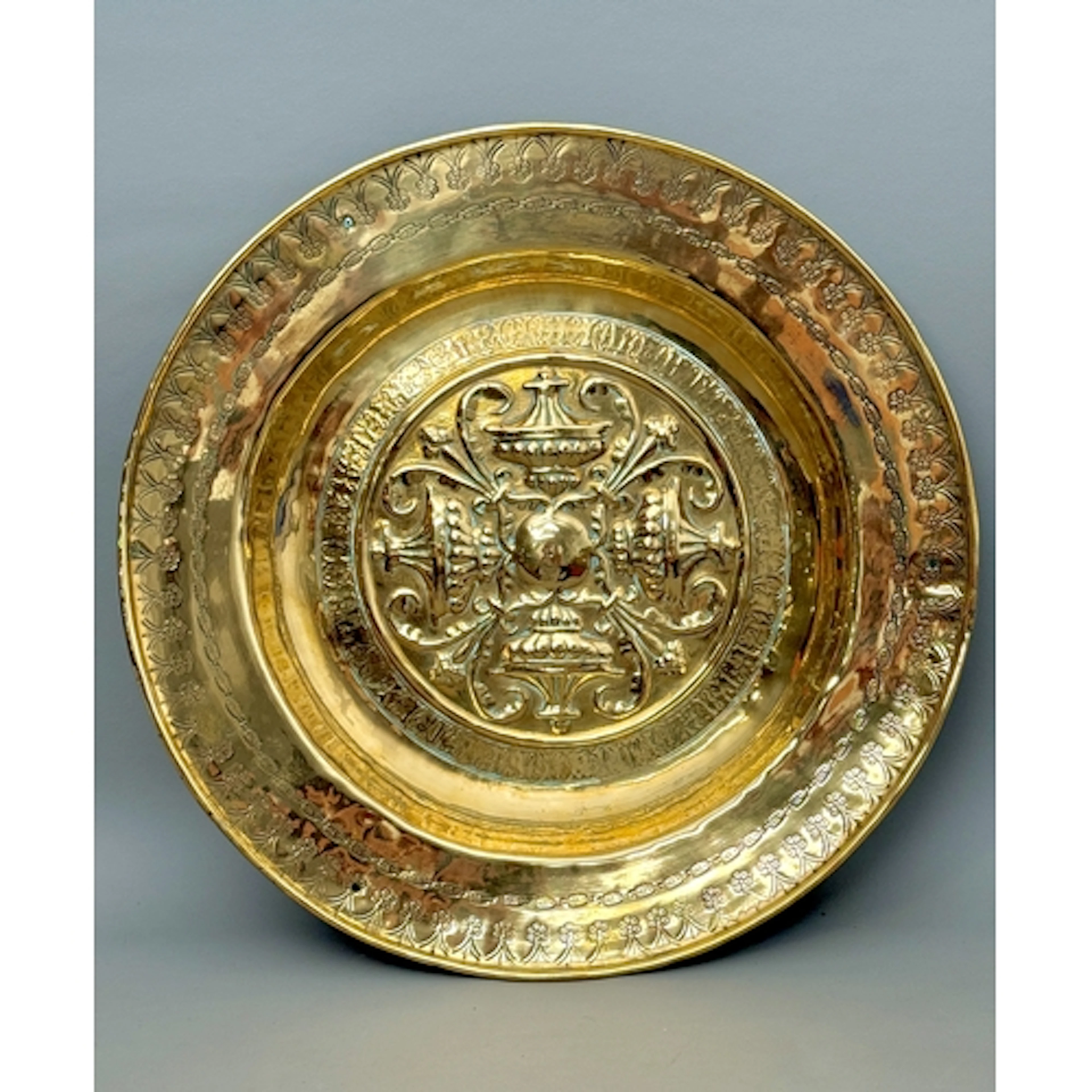 A 16th / 17th century Nuremberg brass alms dish - the centre...
