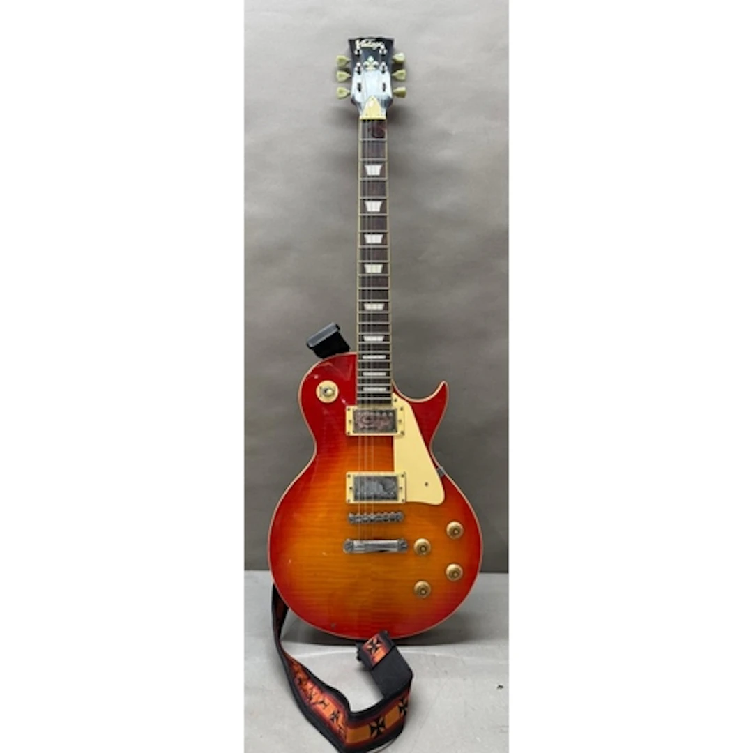 A Vintage V100 electric guitar in cherry burst red.