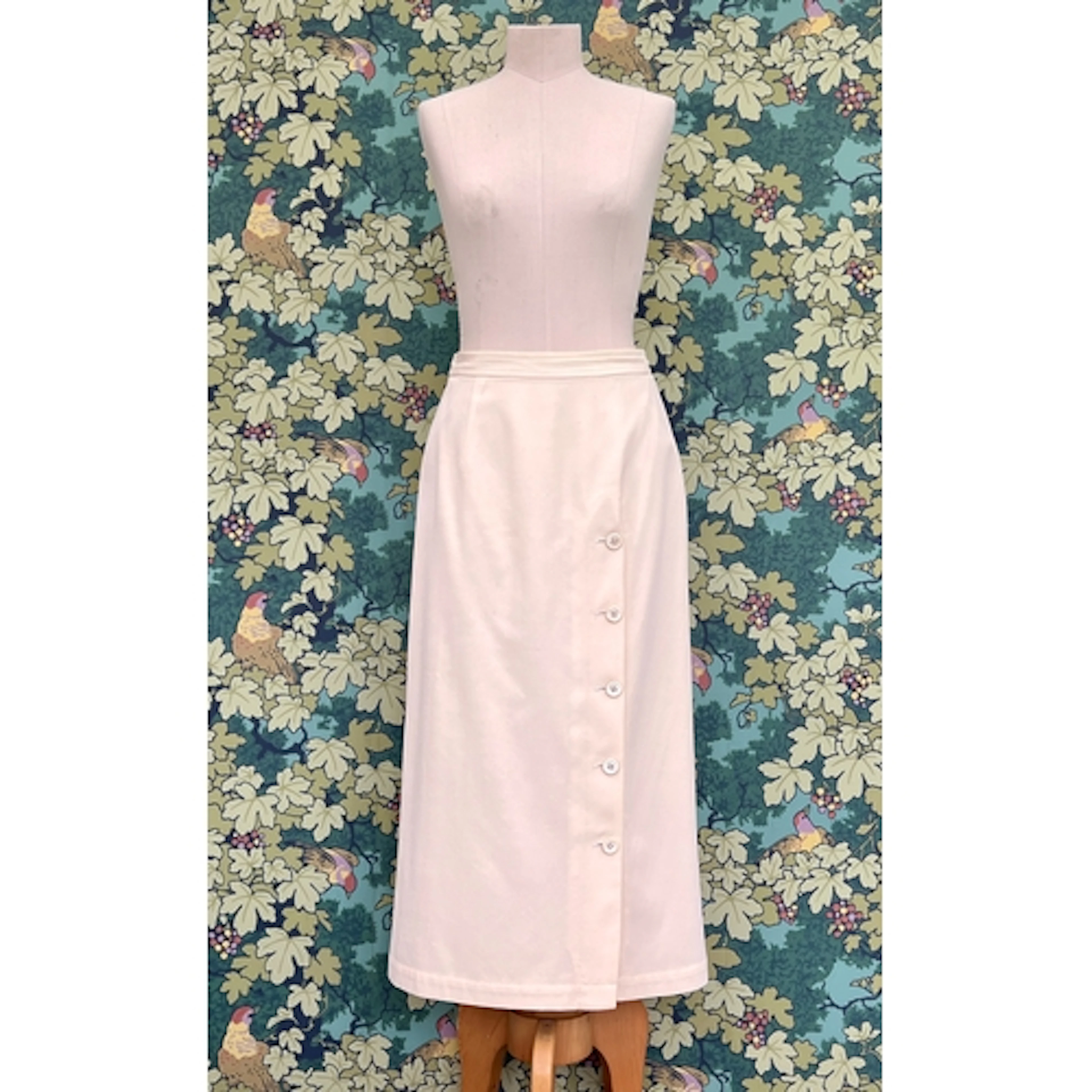 A Comme des Garcons, cream wool twill, midi skirt with off c...