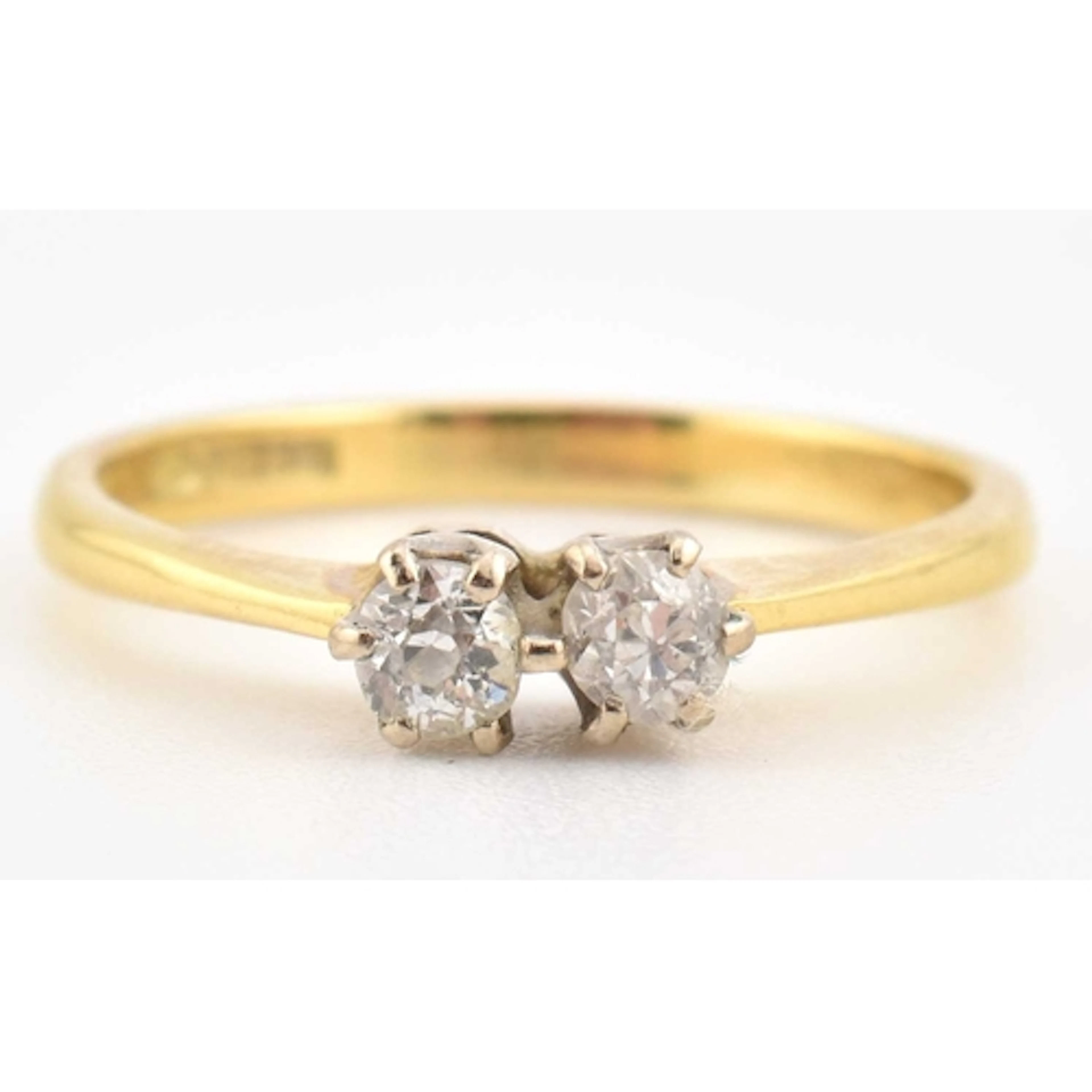 A 1990s hallmarked 18ct gold ring with two 'toi et moi' set ...
