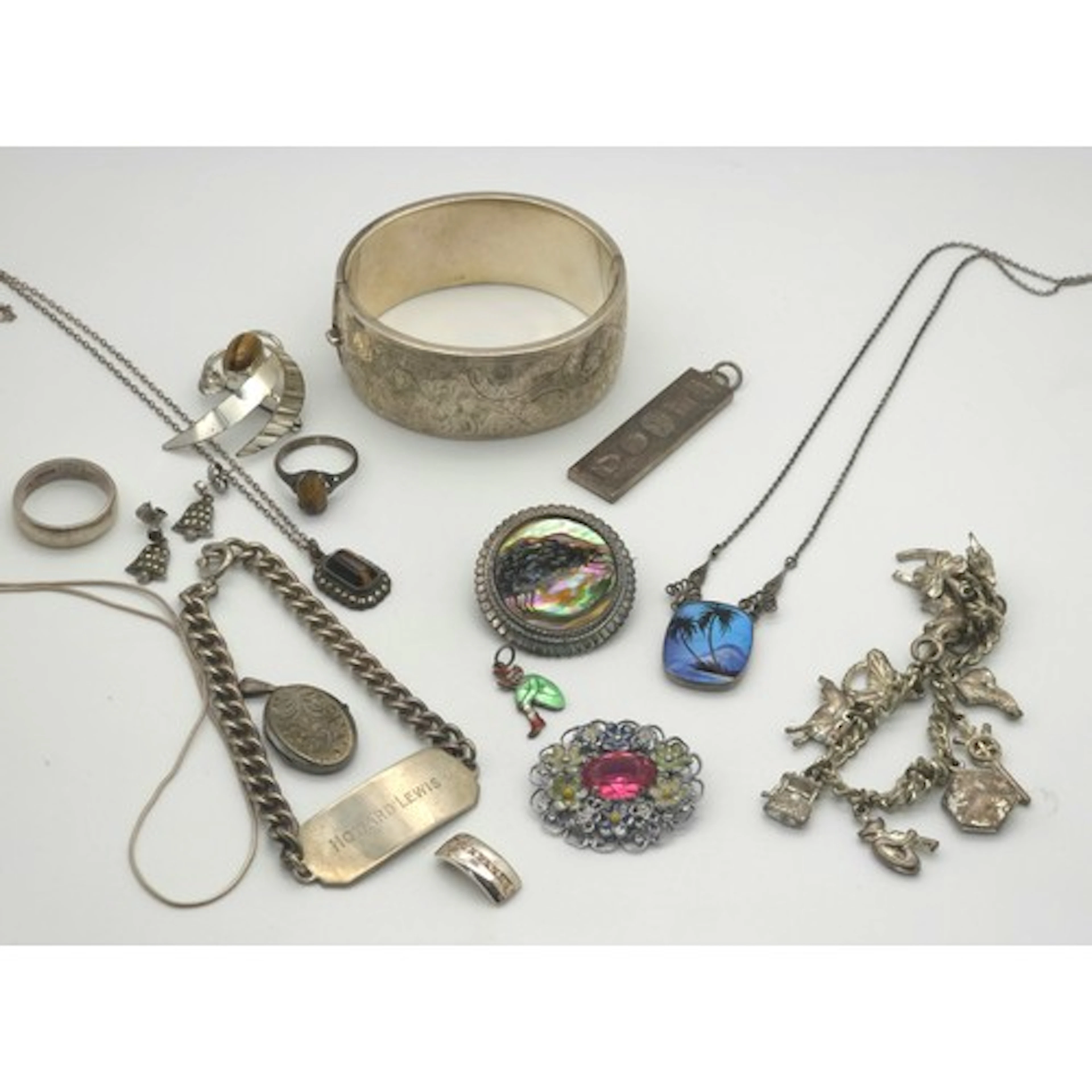 A collection of silver and white metal jewellery, to include...