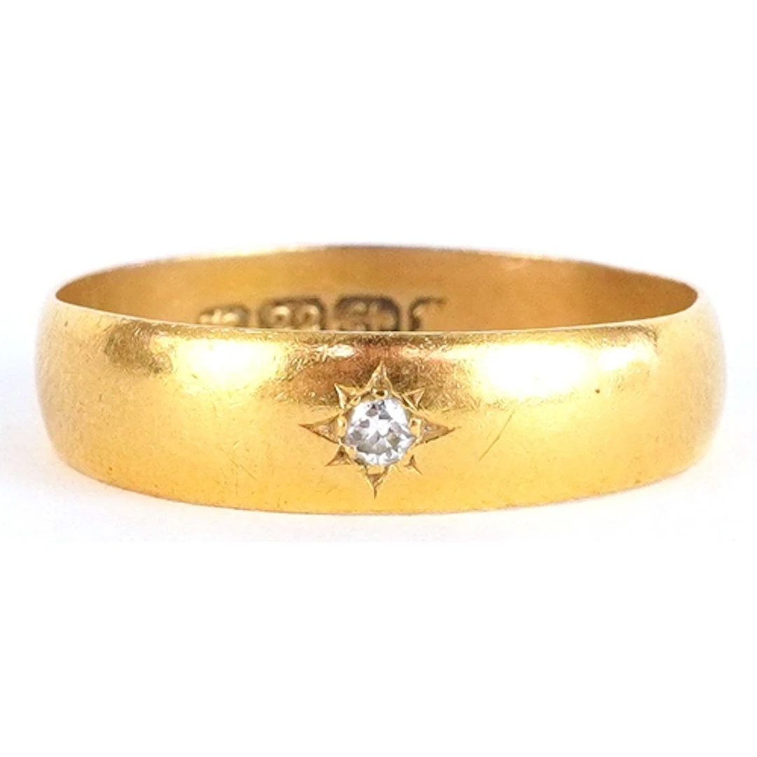 22ct gold wedding band set with a diamond, incomplete hallma...