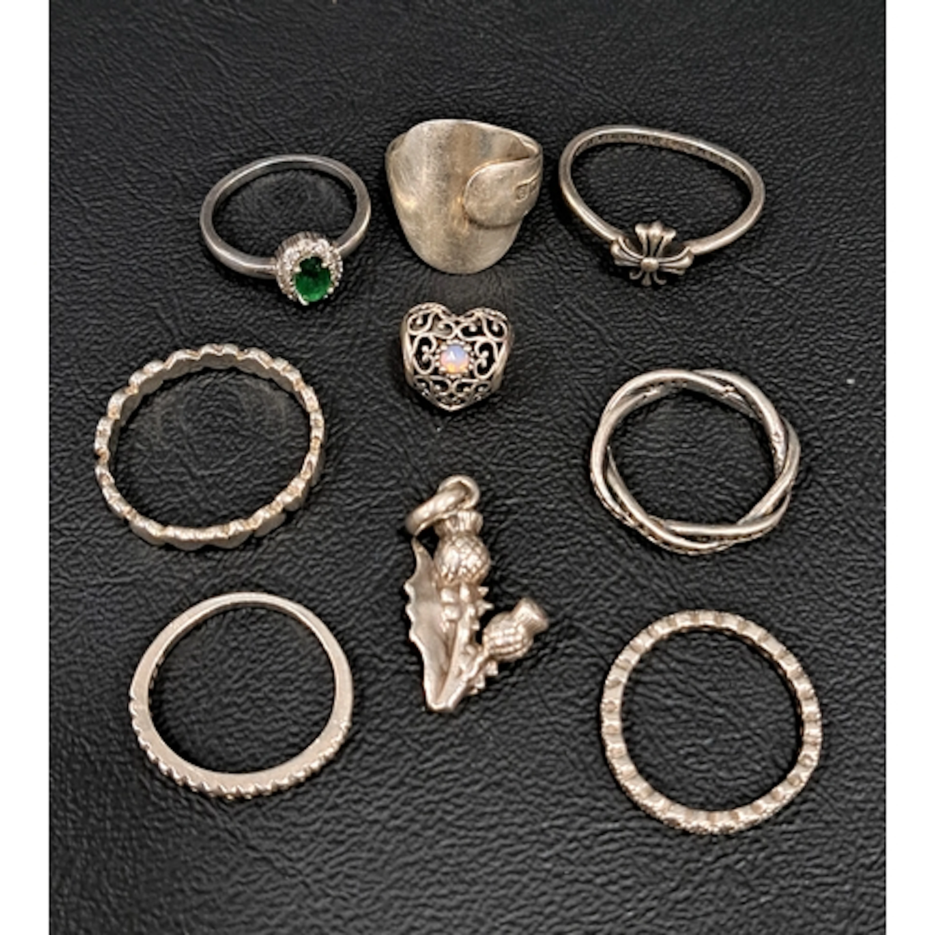 NINE PIECES OF SILVER JEWELLERY comprising seven rings inclu...