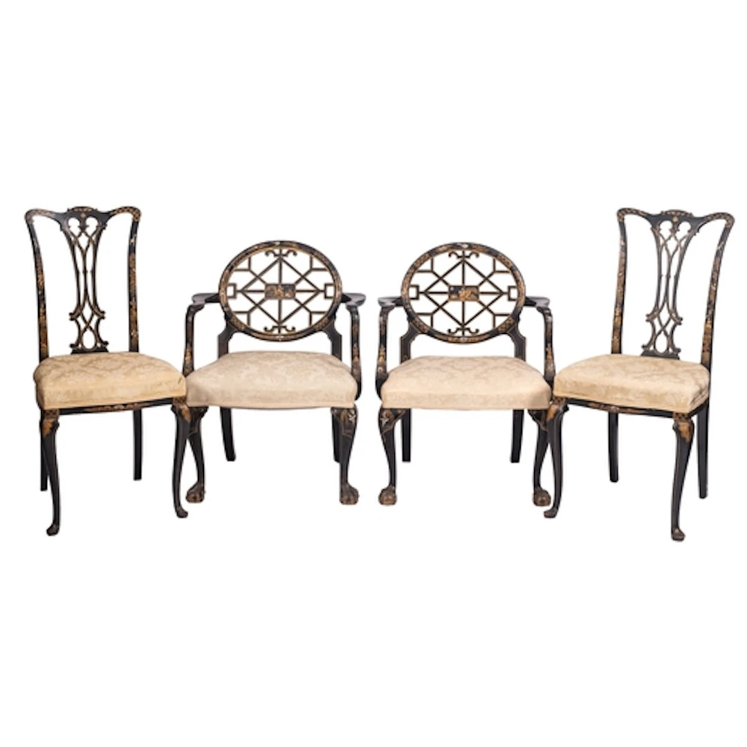 Two pairs of parcel gilt and black lacquered wood chairs in ...