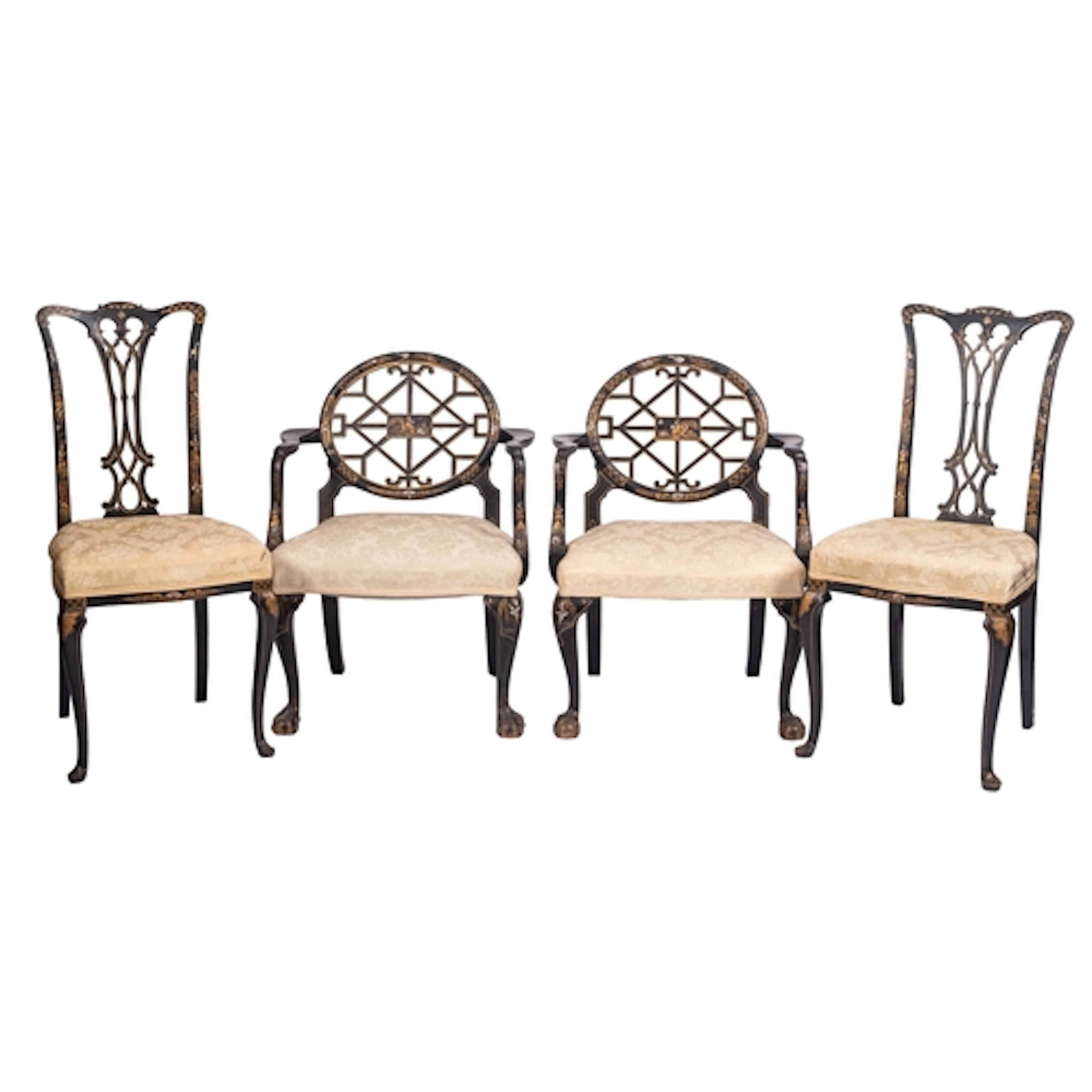 Two pairs of parcel gilt and black lacquered wood chairs in ...