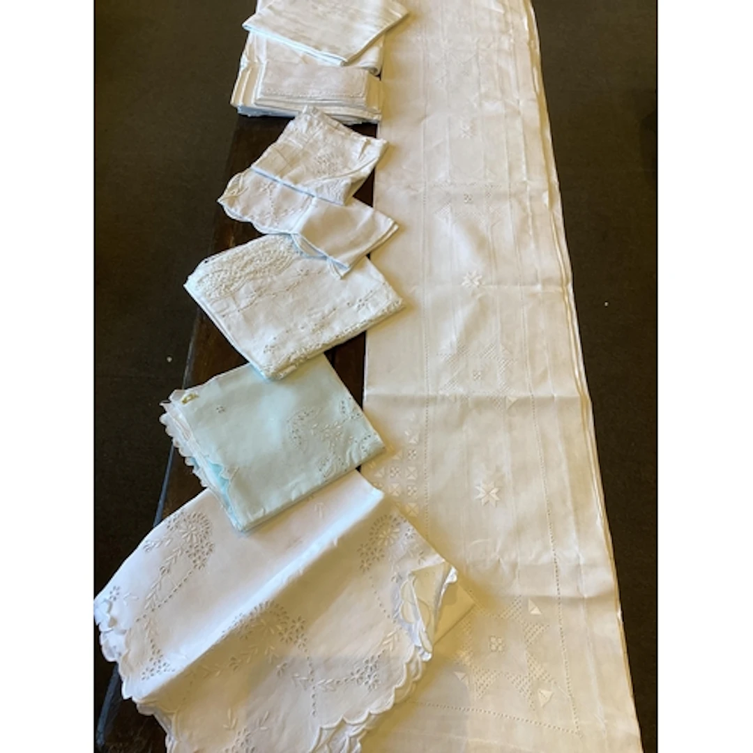 A collection of table linen cloths, including damask, variou...