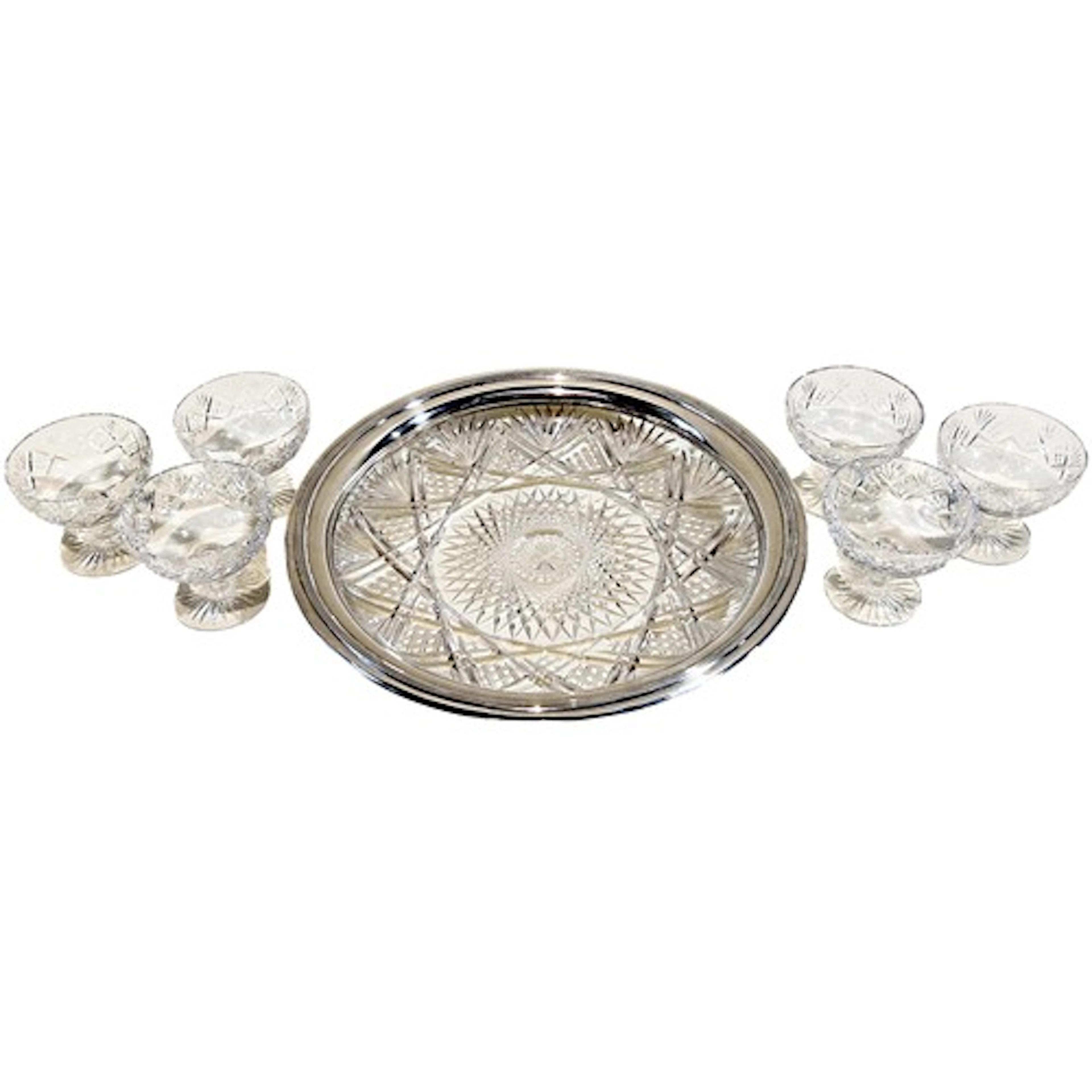 A heavy circular cut glass bowl with hallmarked silver borde...