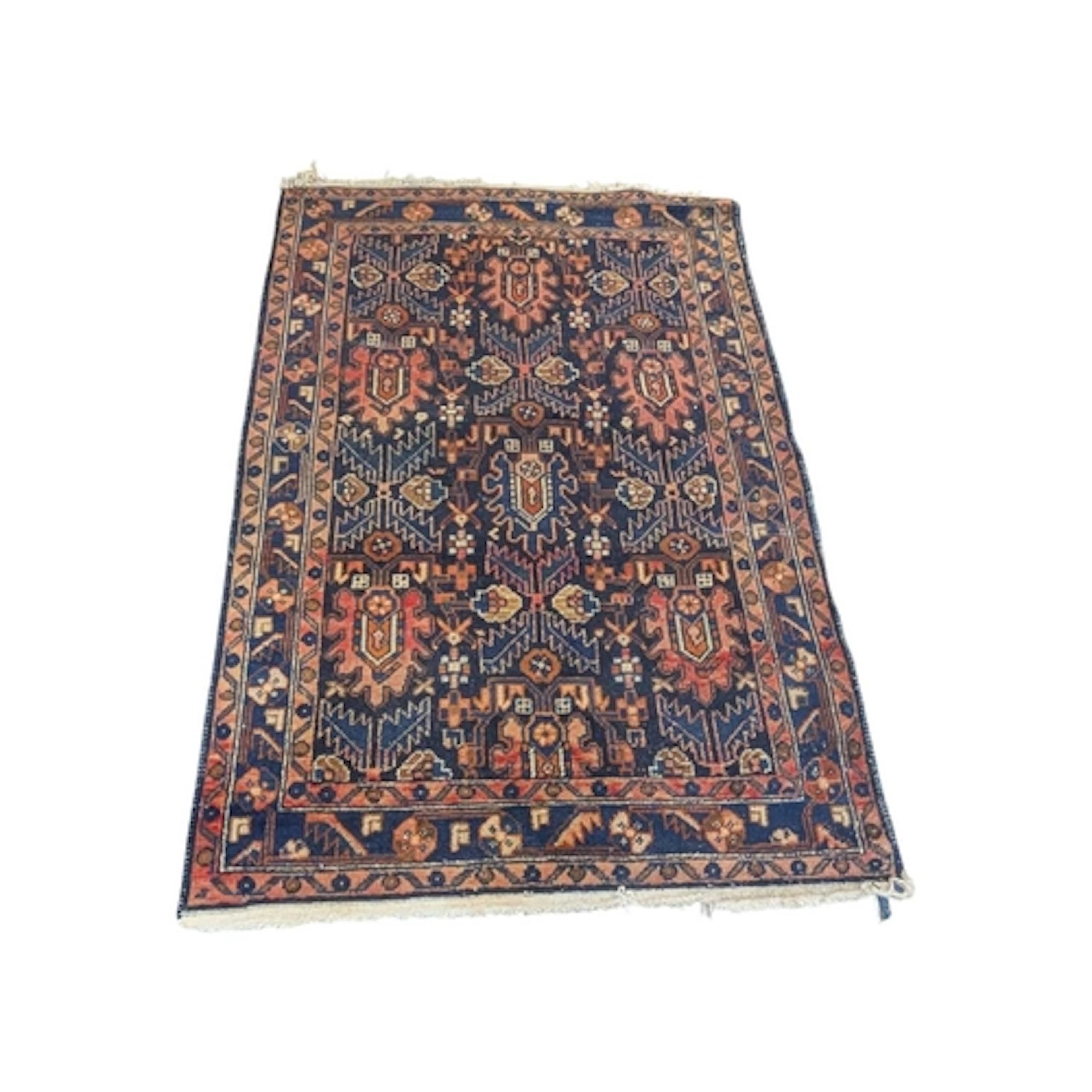 A 20th century Persian Islamic Caucasian carpet floor rug. B...