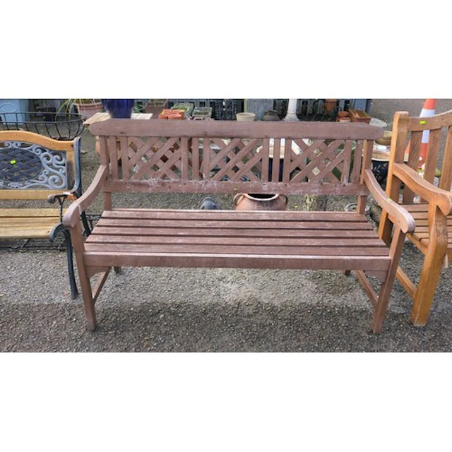 Wooden garden bench with a slatted seat, latticework back di...