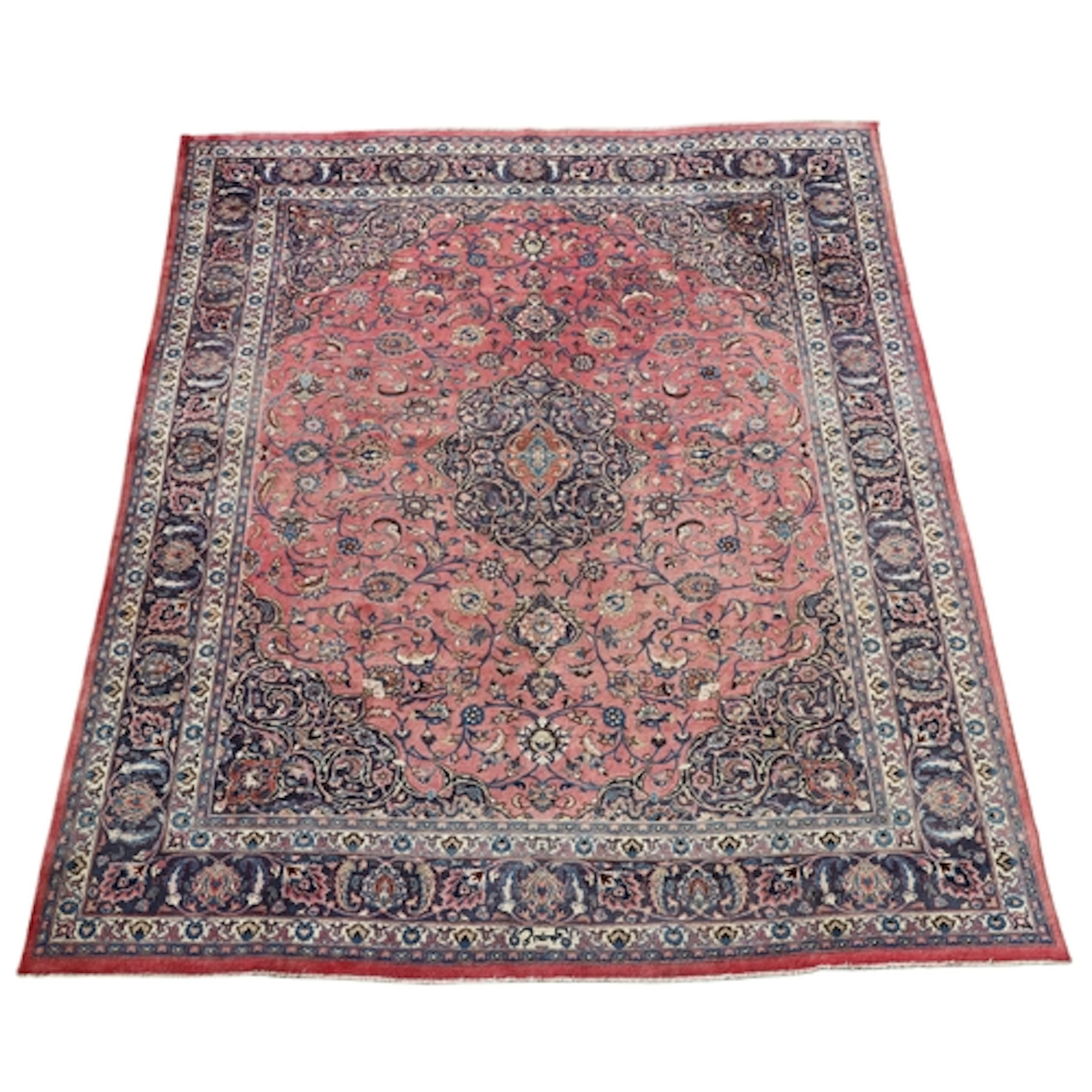 A KHORASAN CARPET. The rose pink field of scrolling vines ce...