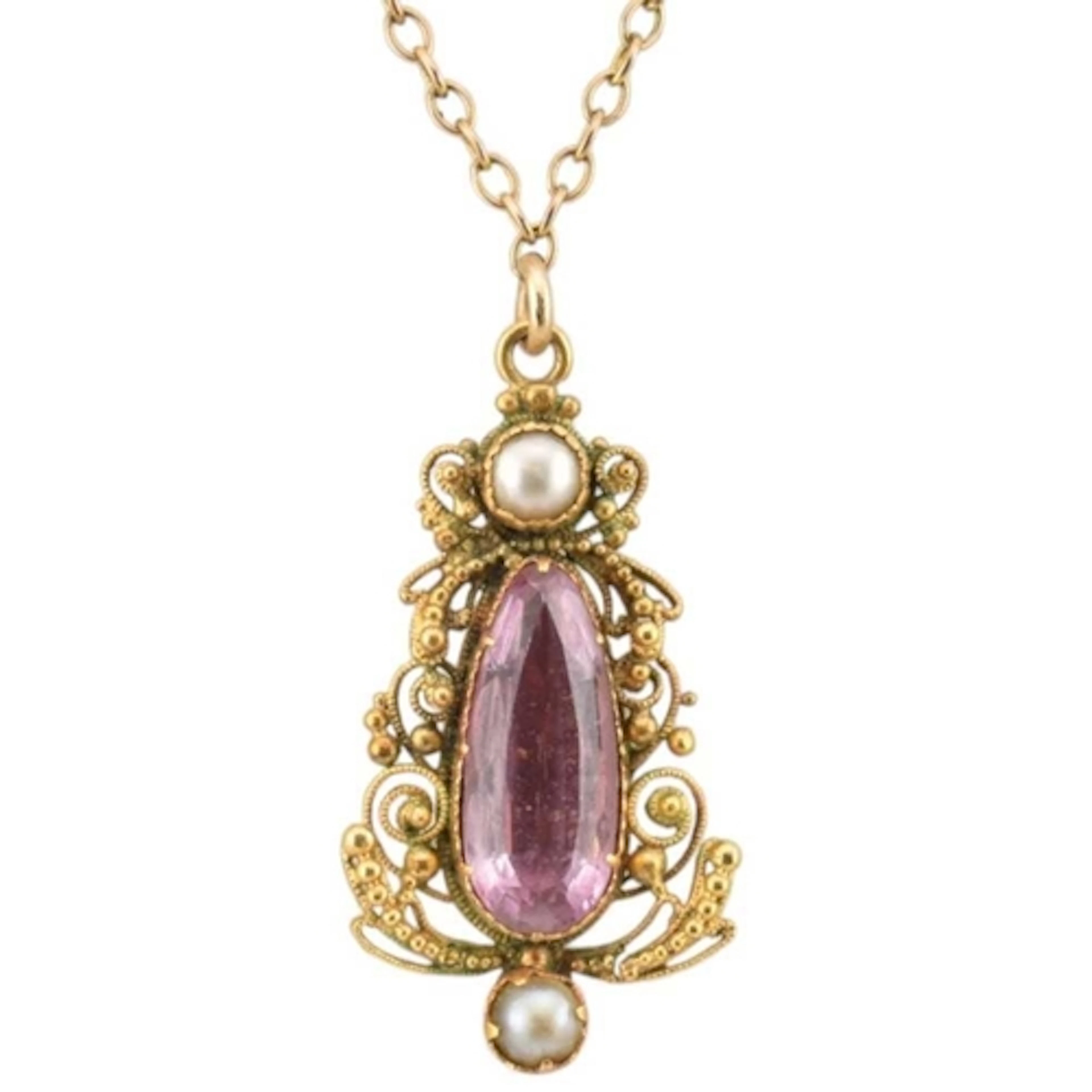 A 19th century pink topaz and pearl pendant on chain. The ne...