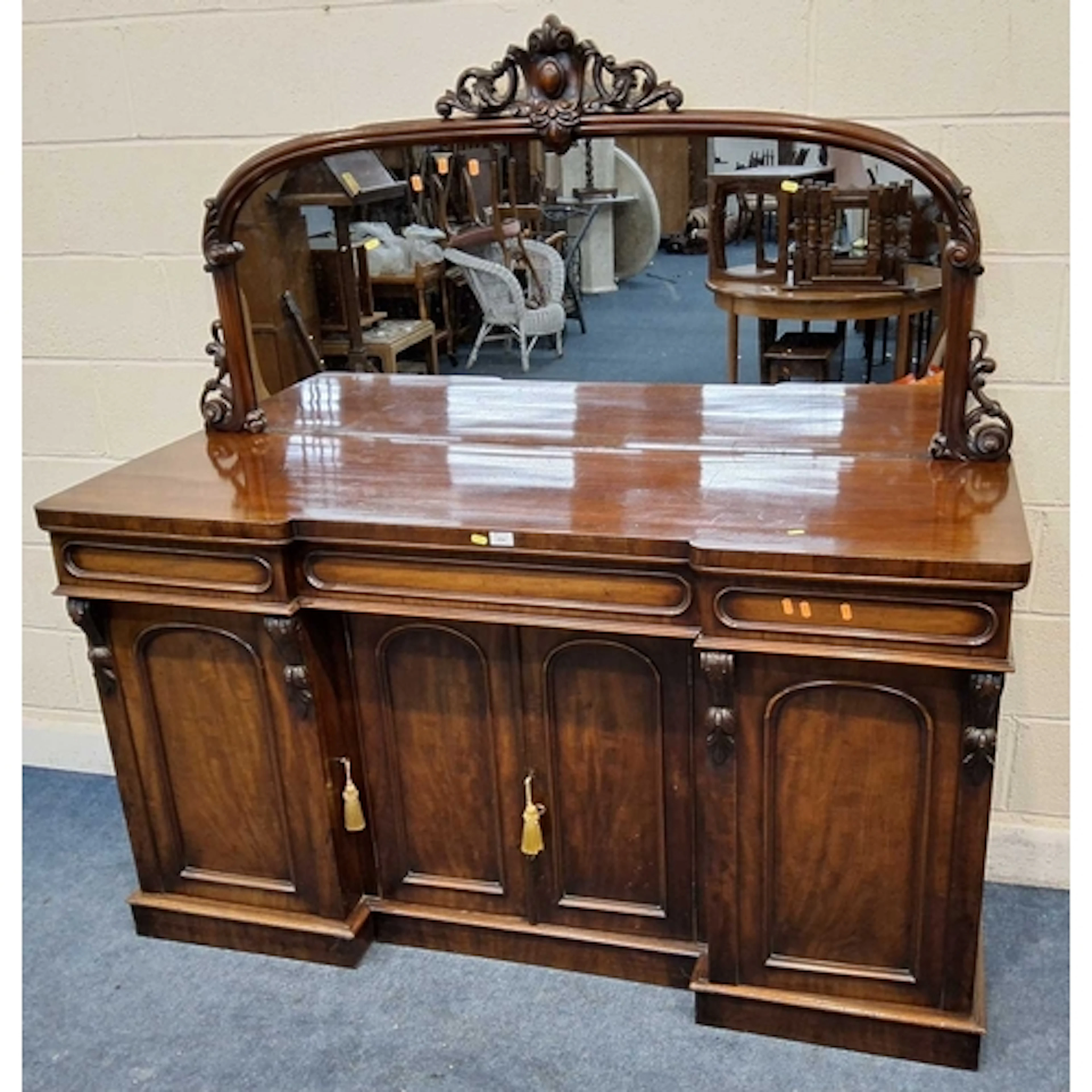 A VICTORIAN MAHOGANY REVERSE BREAK-FRONT MIRROR BACK SIDEBOA...