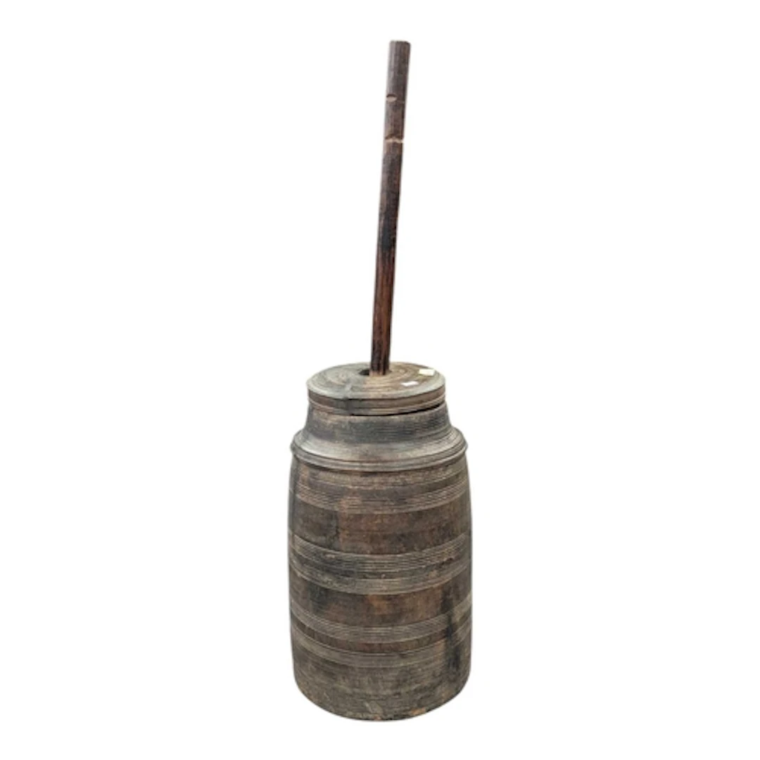 A Nepalese late 19th century turned hardwood butter churn wi...
