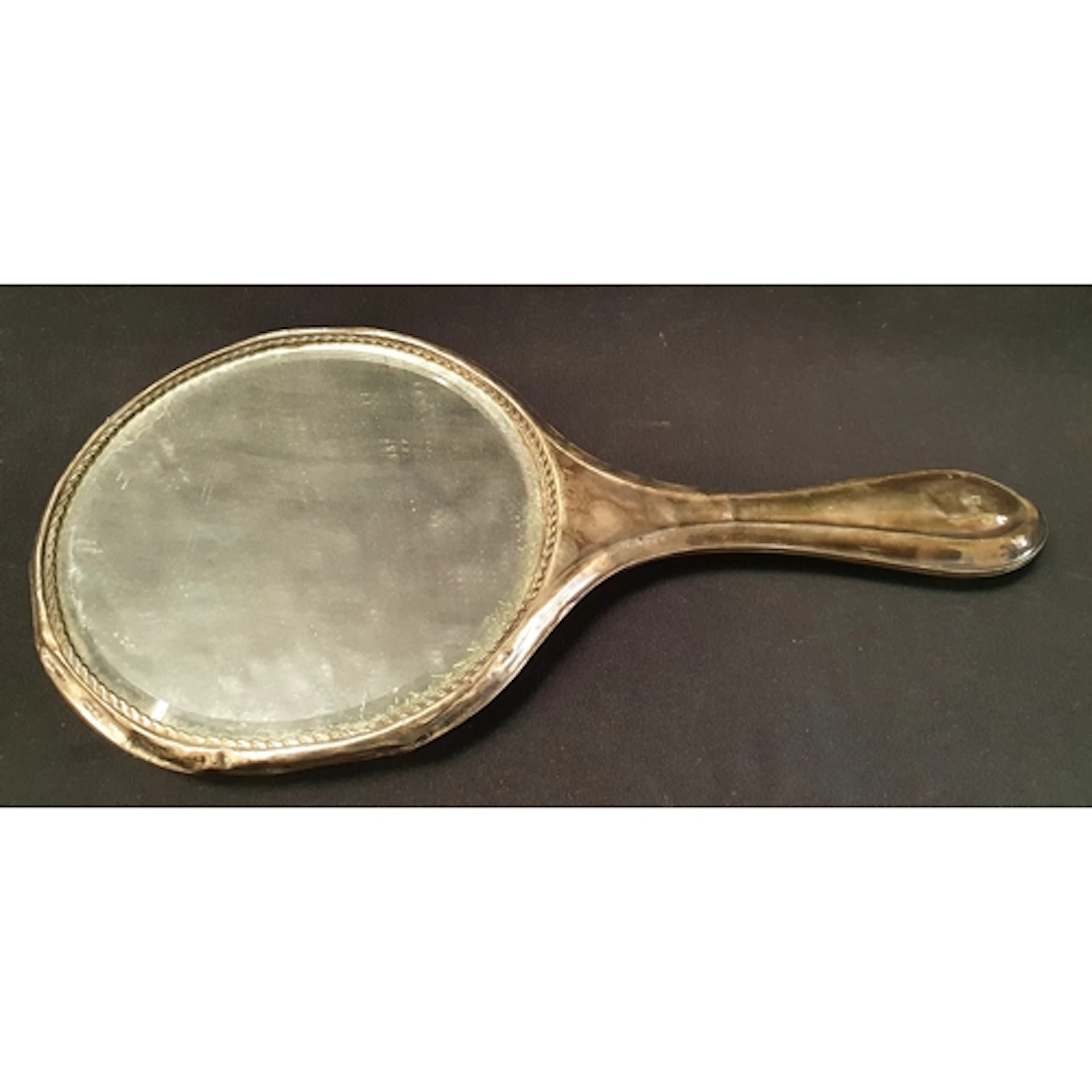 EDWARD VII SILVER BACKED DRESSING MIRROR with dents and wear...