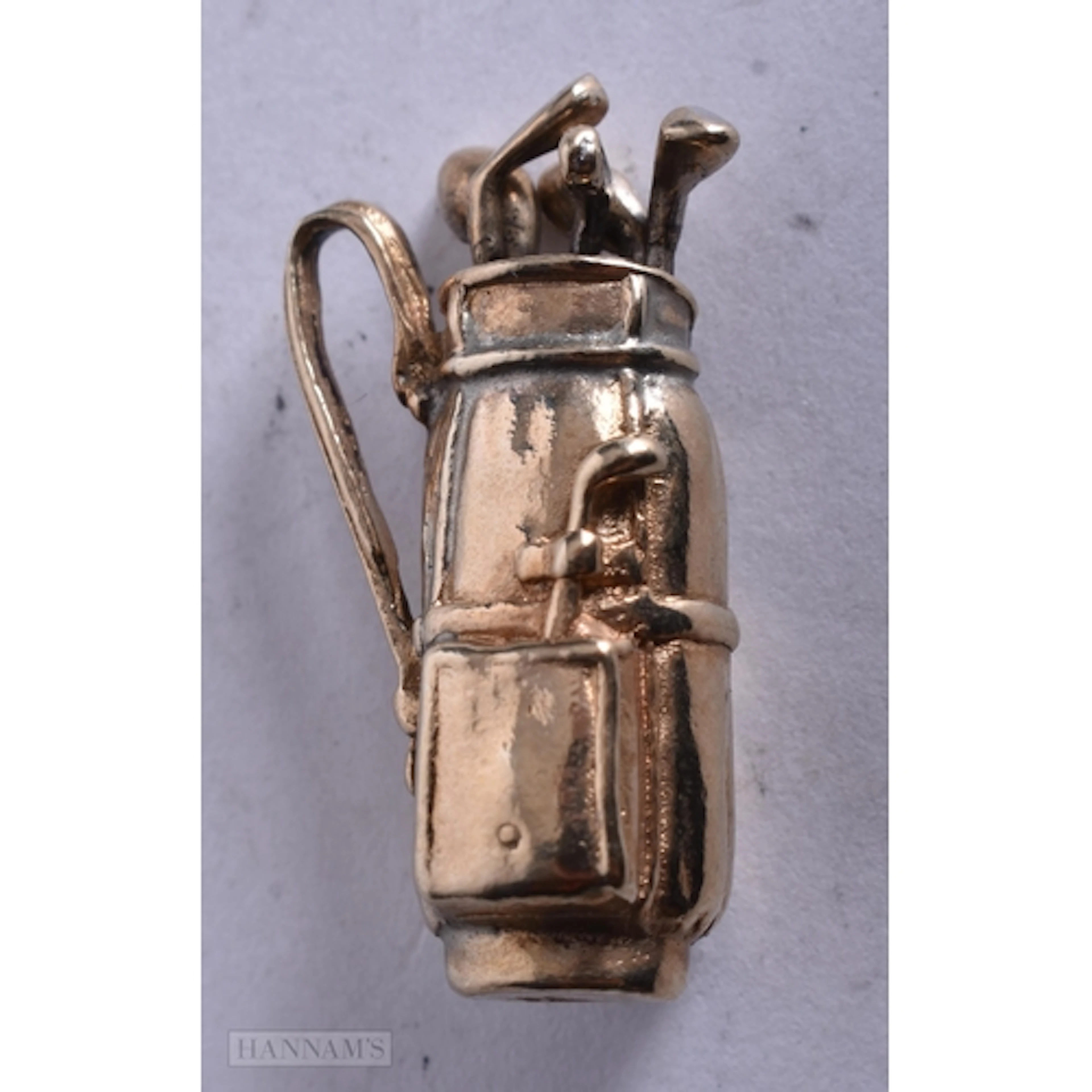 A LOVELY 9CT GOLD GOLF BAG CHARM. 7.1 grams. 2.5 cm x 1.25 c...