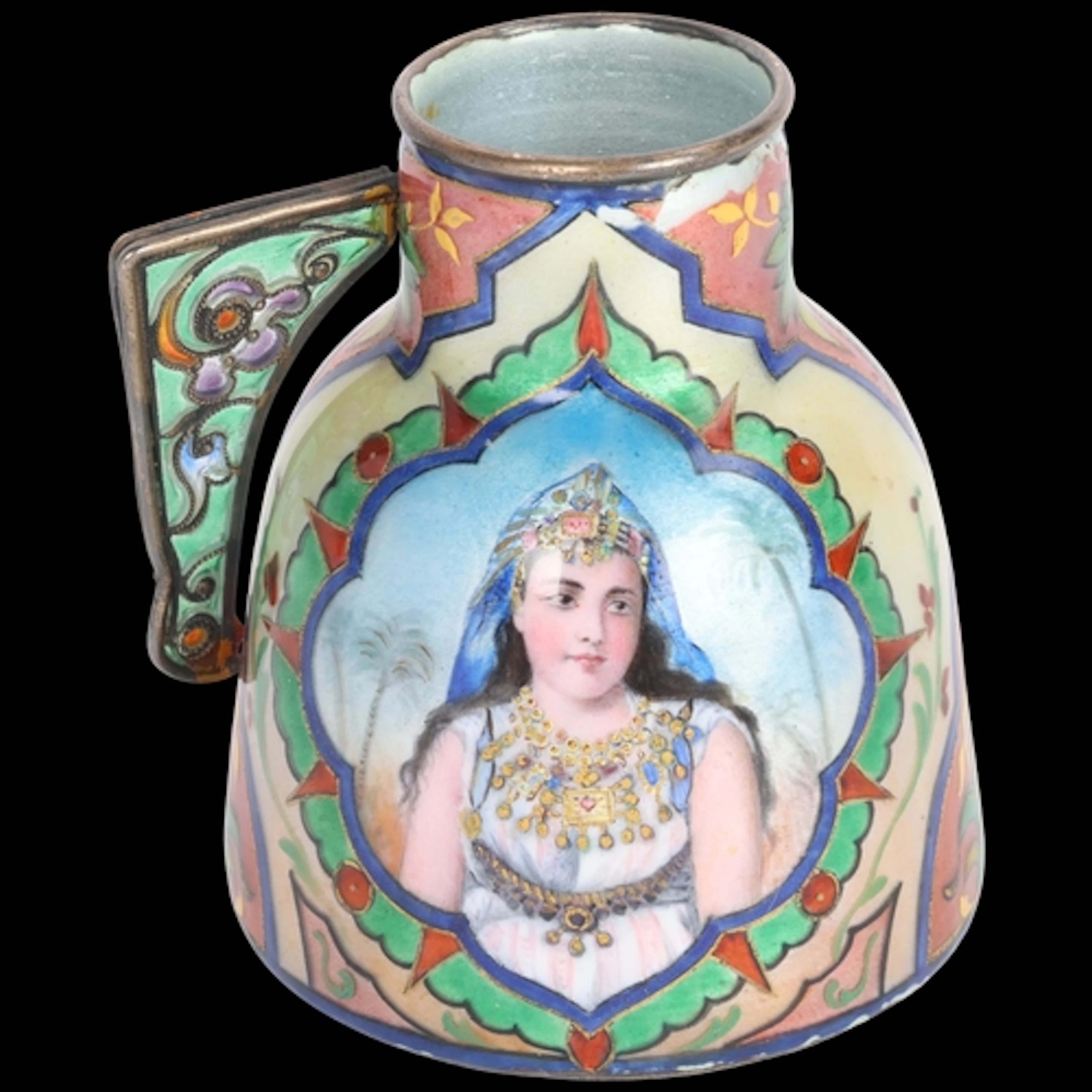 An Art Nouveau silver-gilt enamel Orientalist cream jug, han...