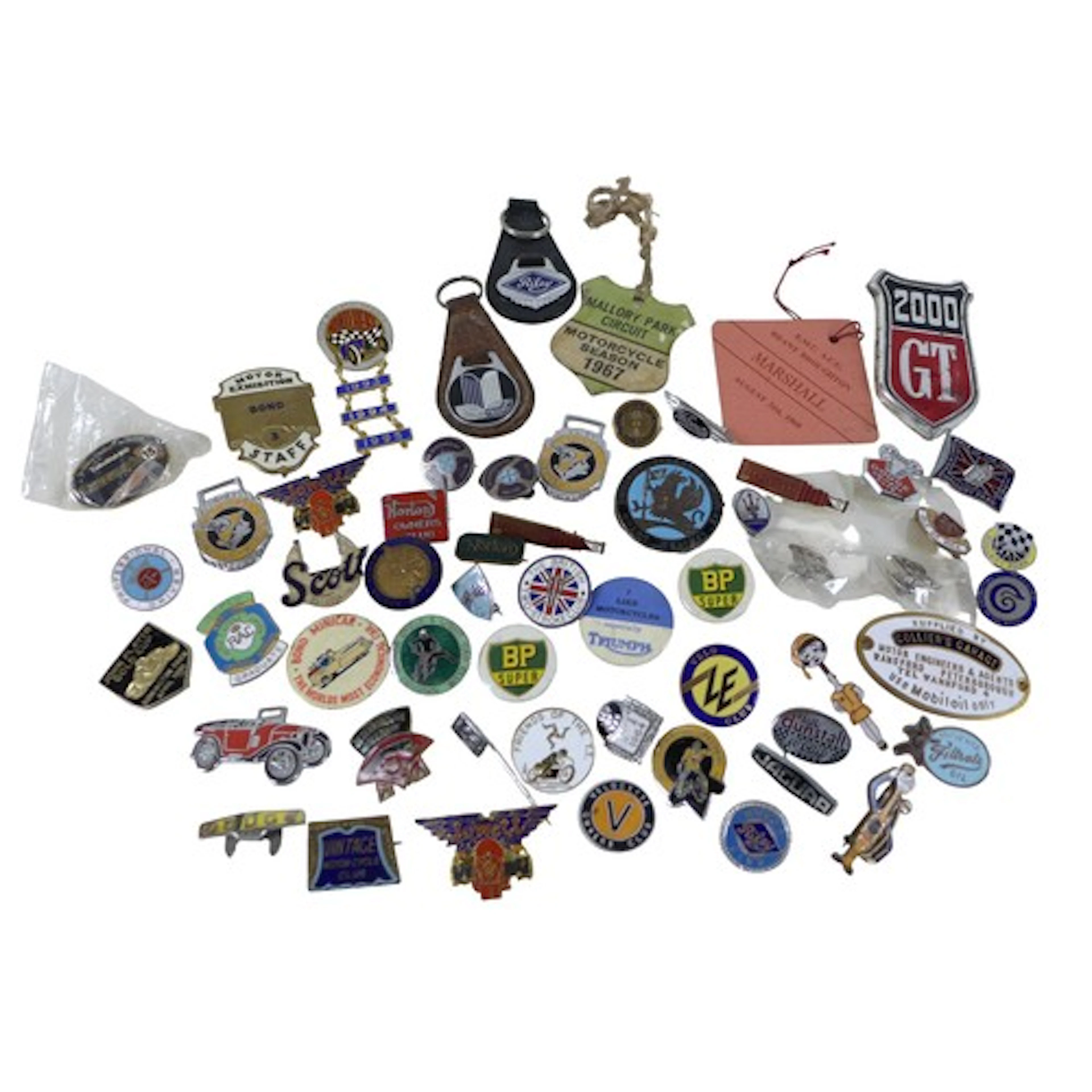 A collection of vintage motoring enamel badges, advertising,...