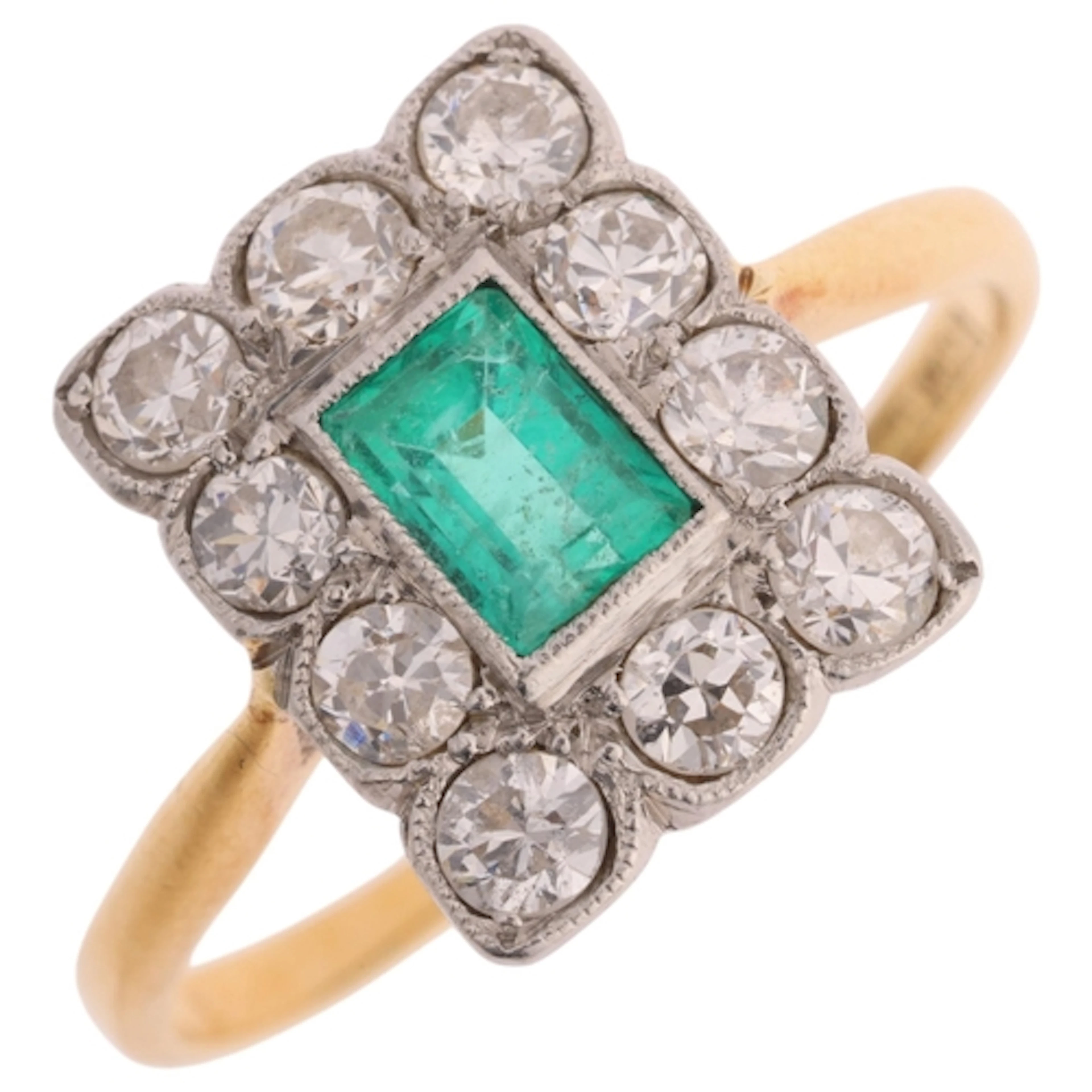 An 18ct gold emerald and diamond cluster ring, platinum-topp...