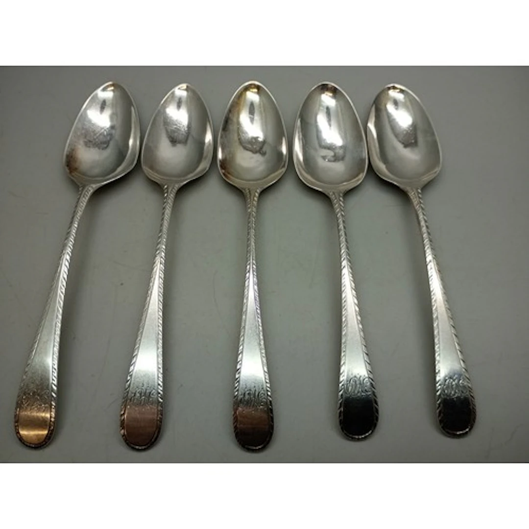 A set of George III silver spoons with monograms, London, 18...
