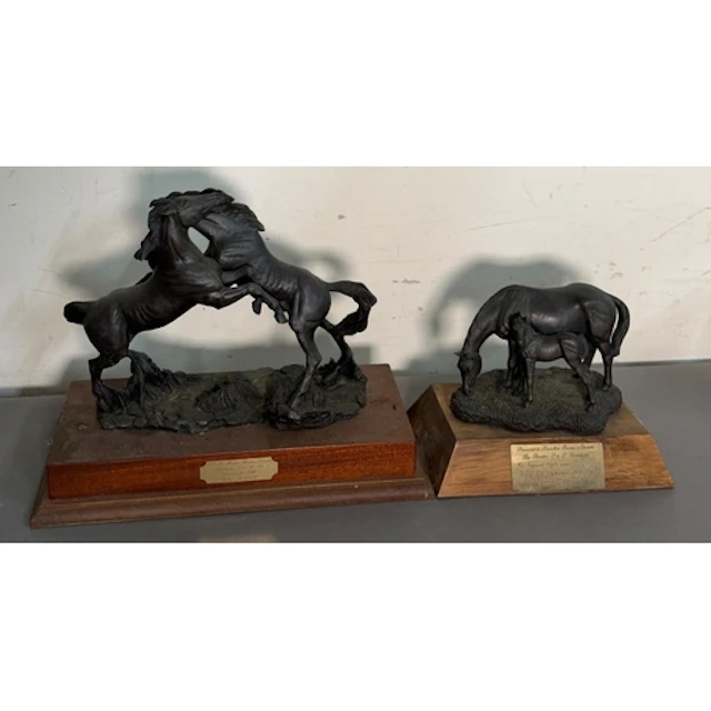 Horse racing interest. Two horse racing trophies presented t...