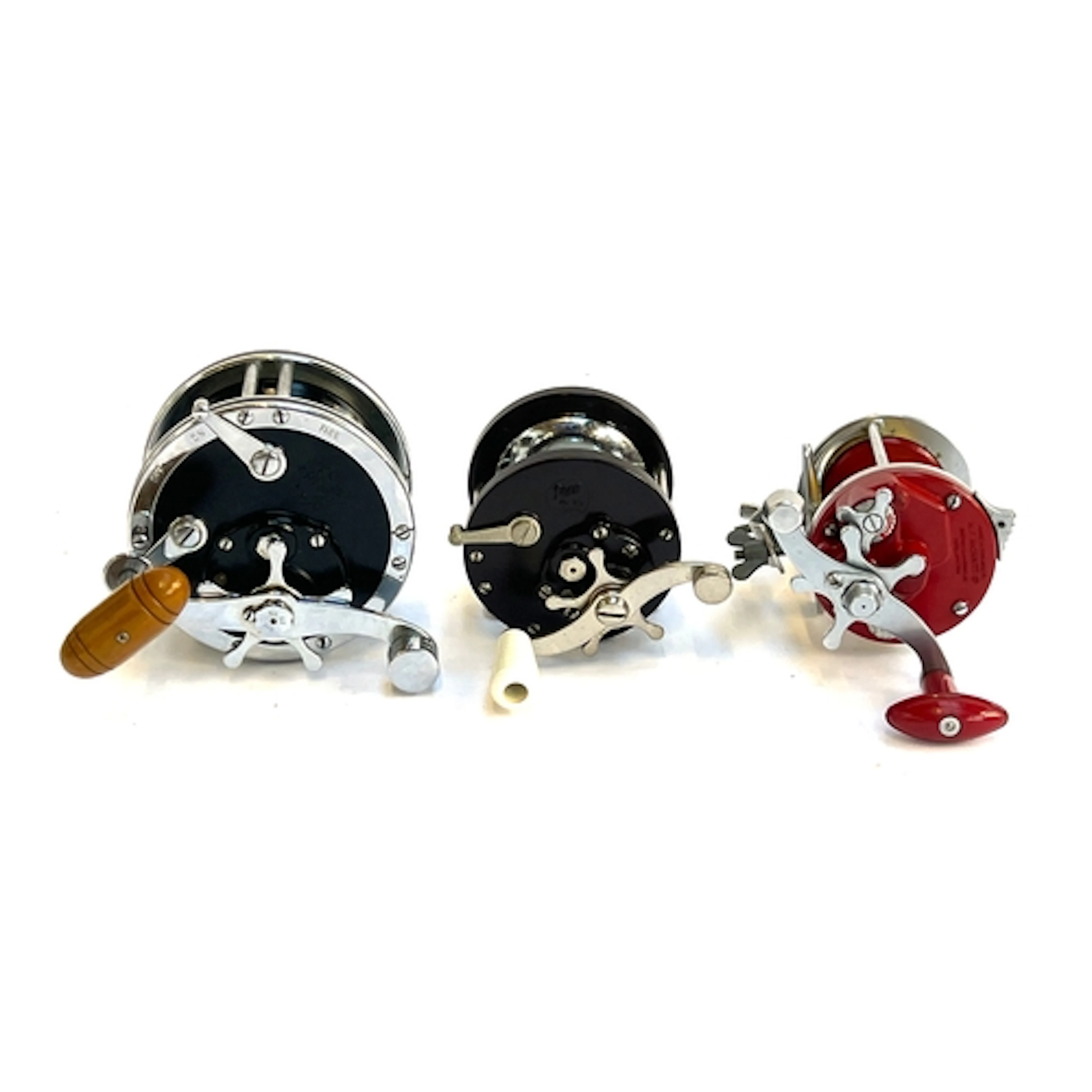 A Penn no. 49 deep sea reel, a Penn no. 85 reel and a KP Mor...