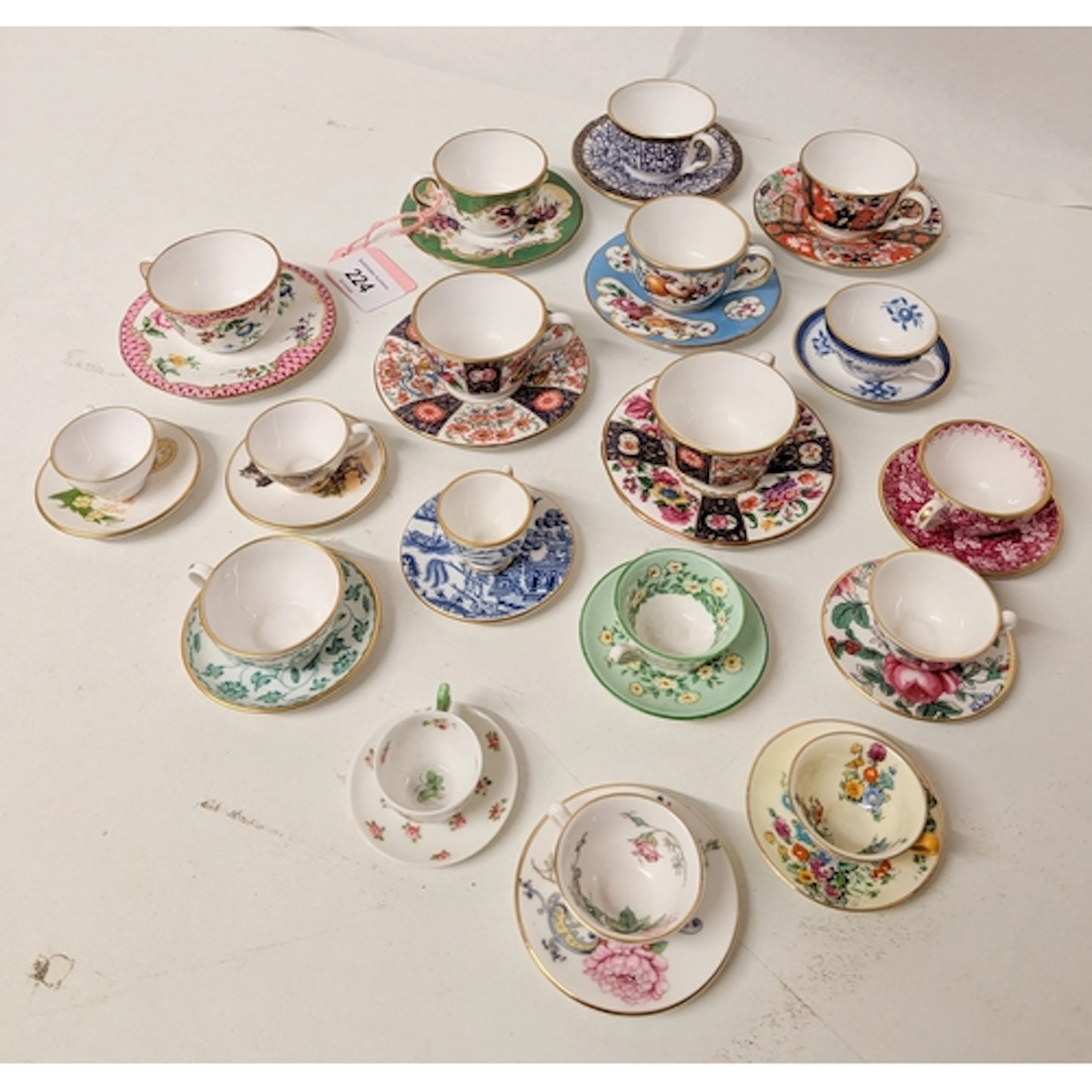 A collection of seven Royal Worcester miniature cabinet cups...