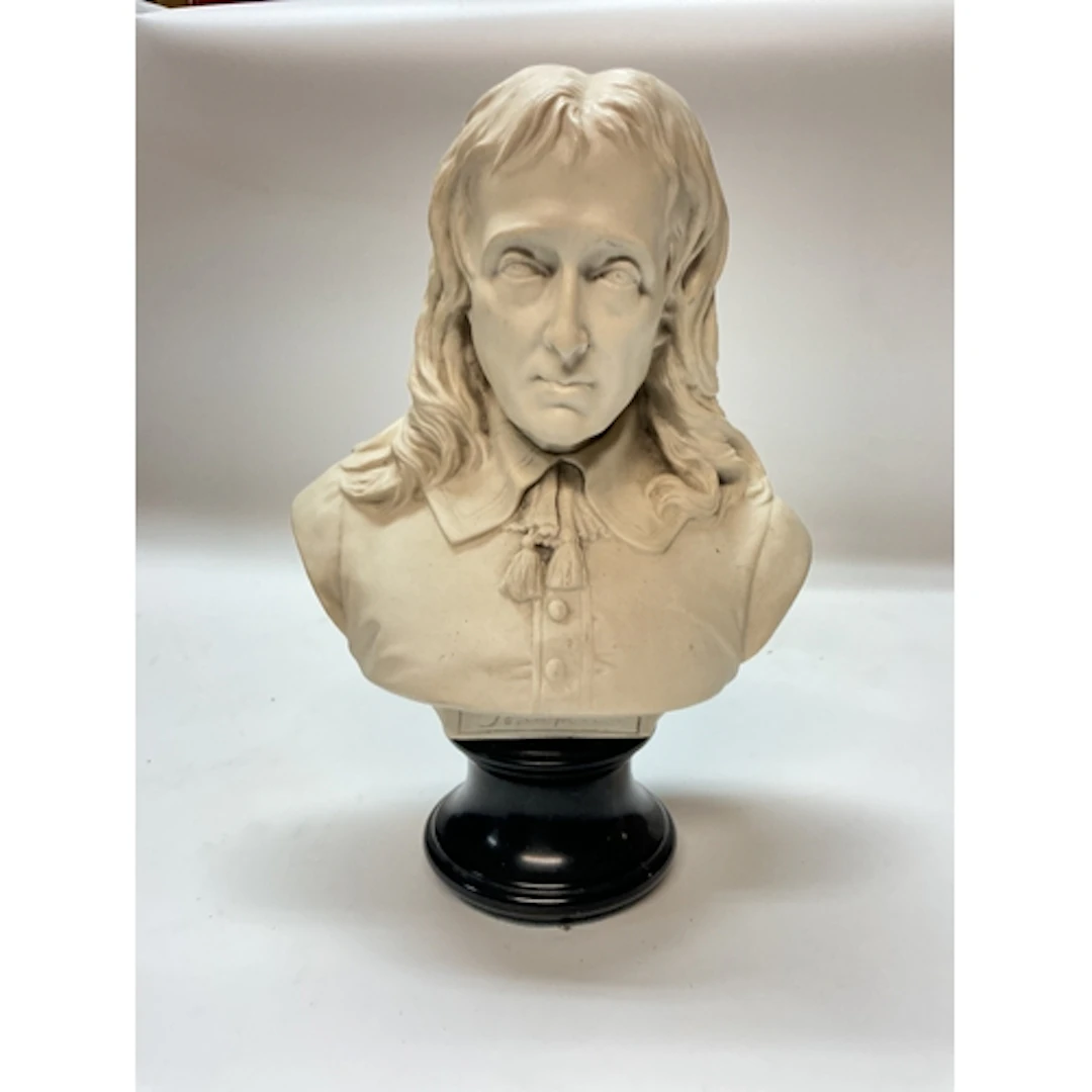 A resin bust of the English poet John Milton, 32cm tall