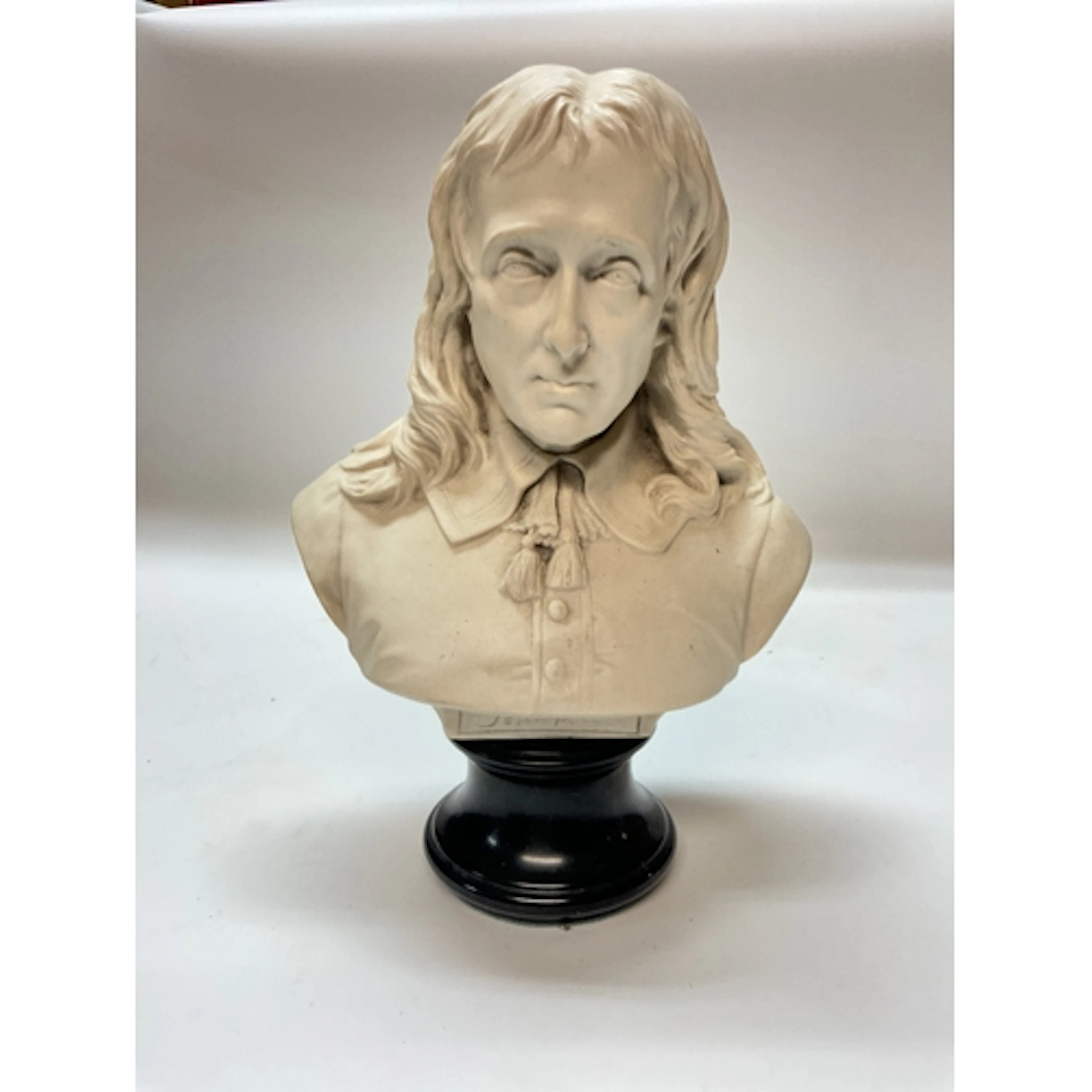 A resin bust of the English poet John Milton, 32cm tall