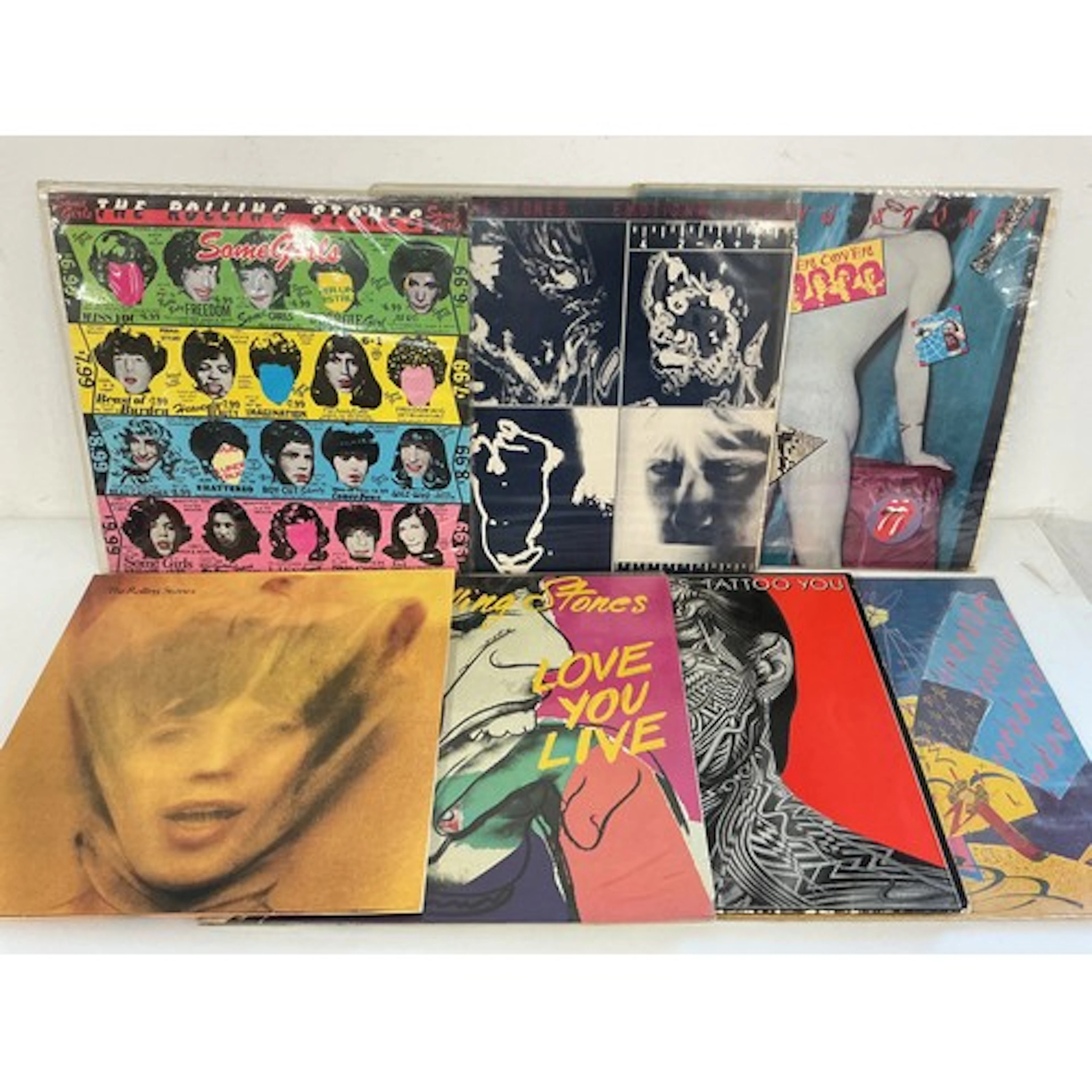 Fifteen Rolling Stones and related LPs and 12” singles compr...