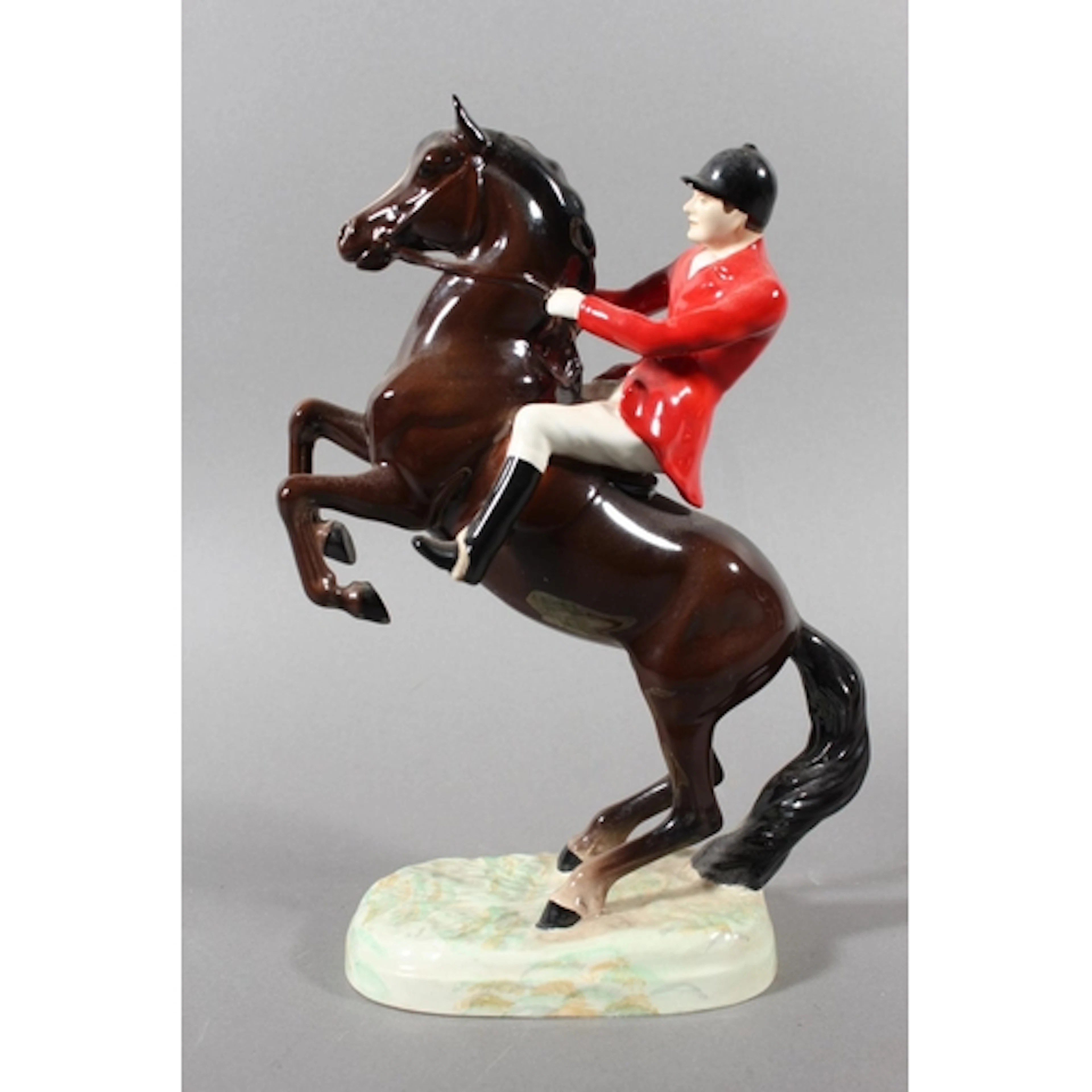 Beswick bone china model of a huntsman on rearing horse, num...