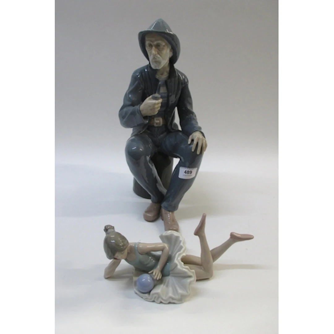 Large Nao porcelain figure of a seated sailor, 38cm high, to...