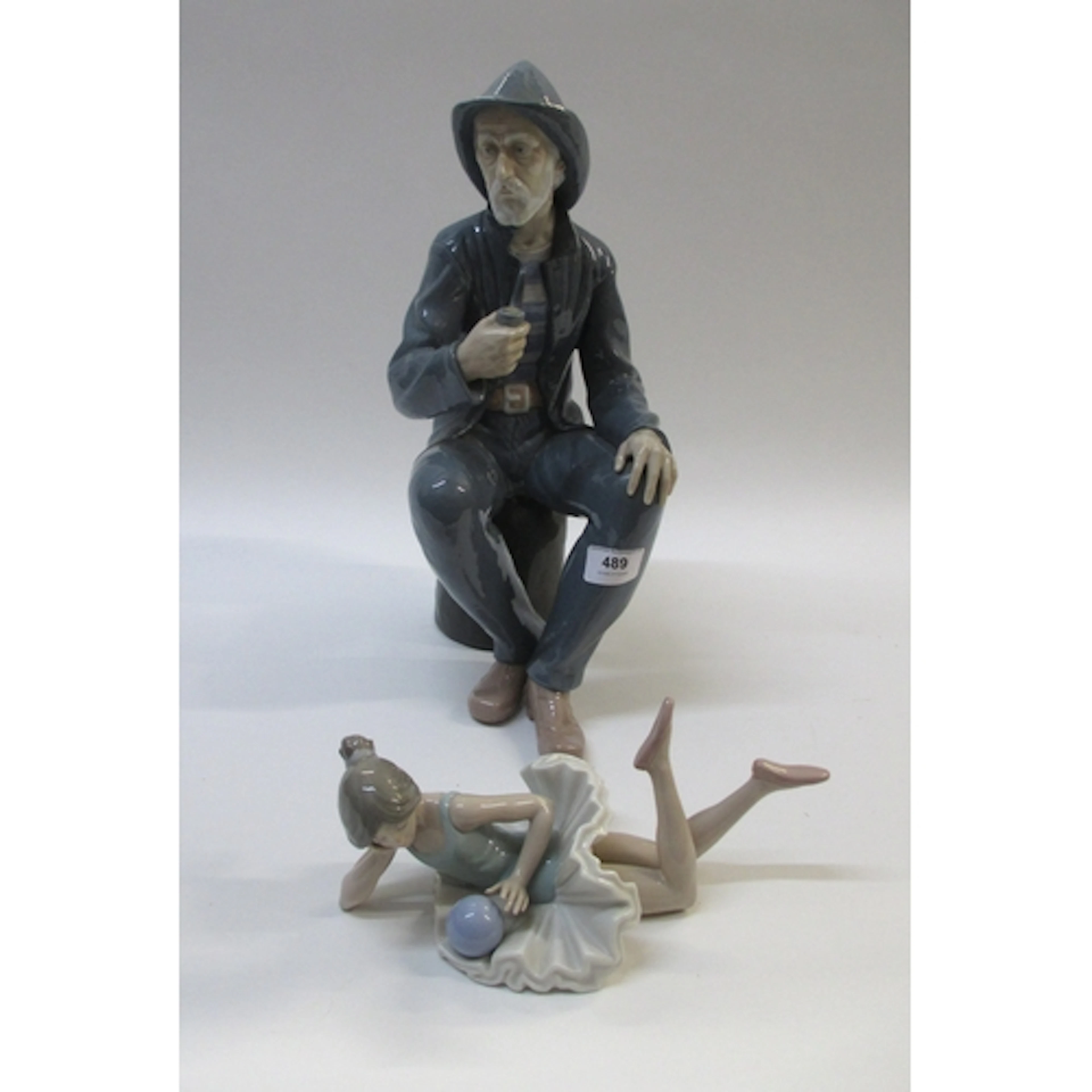 Large Nao porcelain figure of a seated sailor, 38cm high, to...