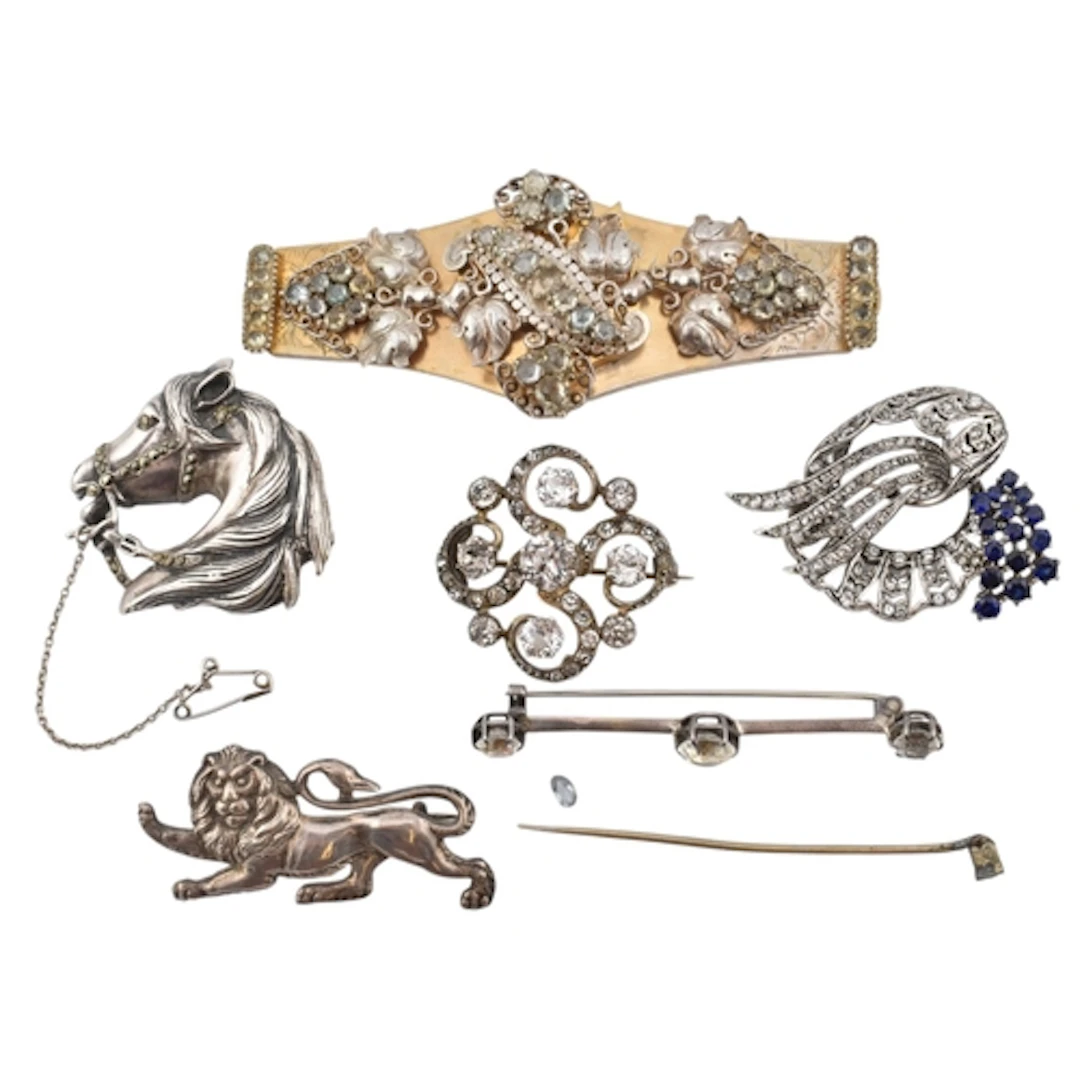 A selection of white metal brooch pins. Five items to includ...