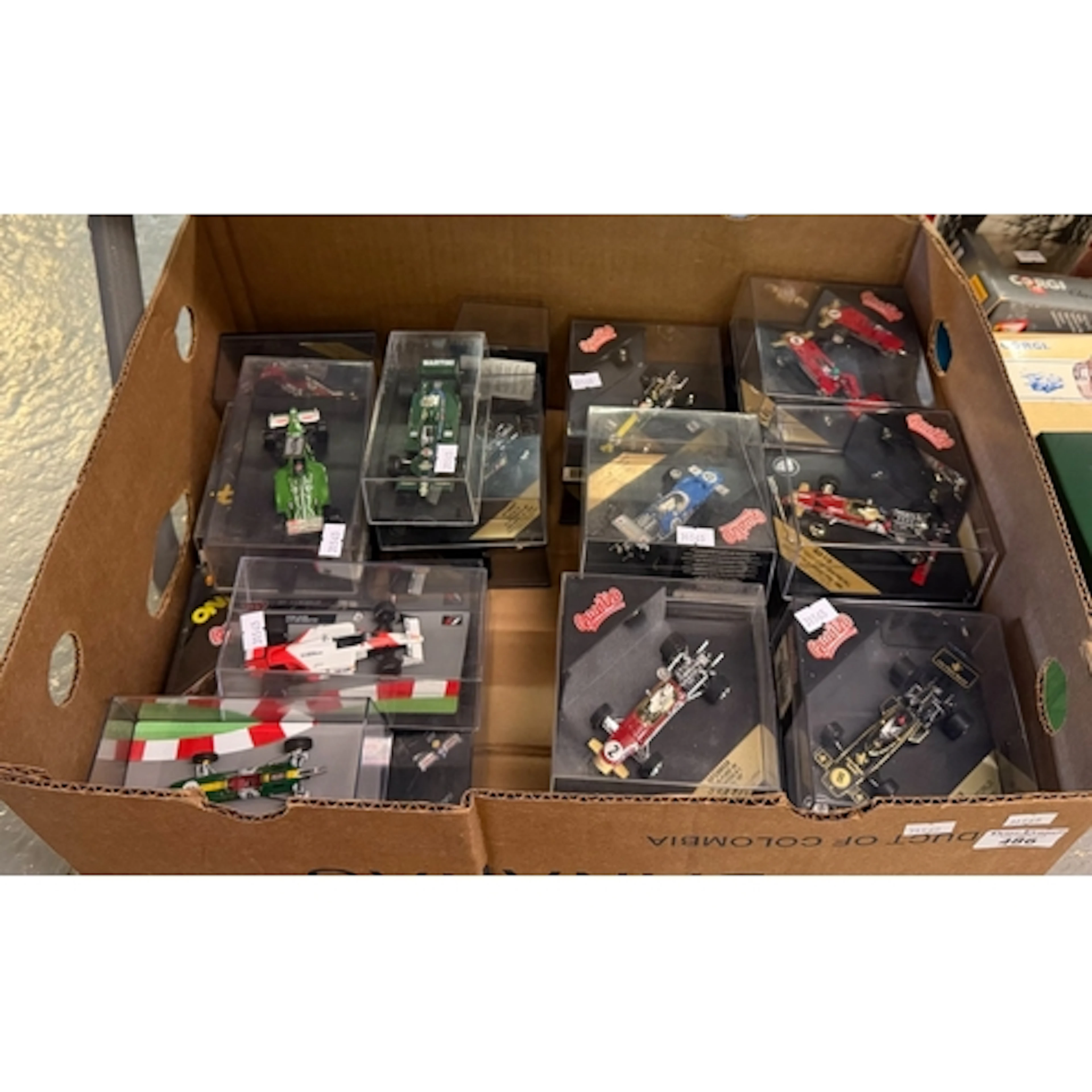 Collection of Quartzo Formula 1 Racing Cars in perspex displ...