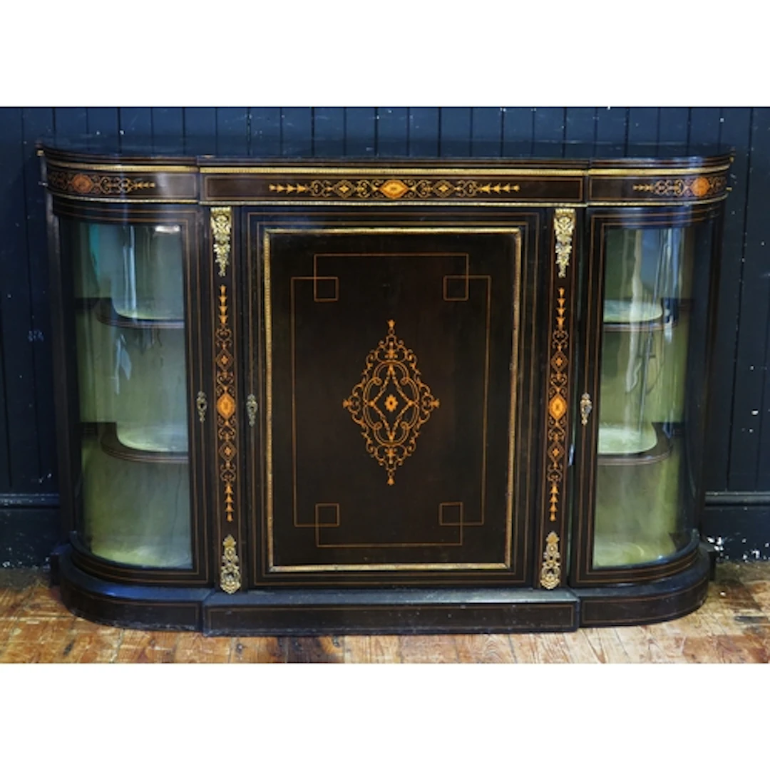 A Victorian ebonised and inlaid credenza, of bow-shaped outl...