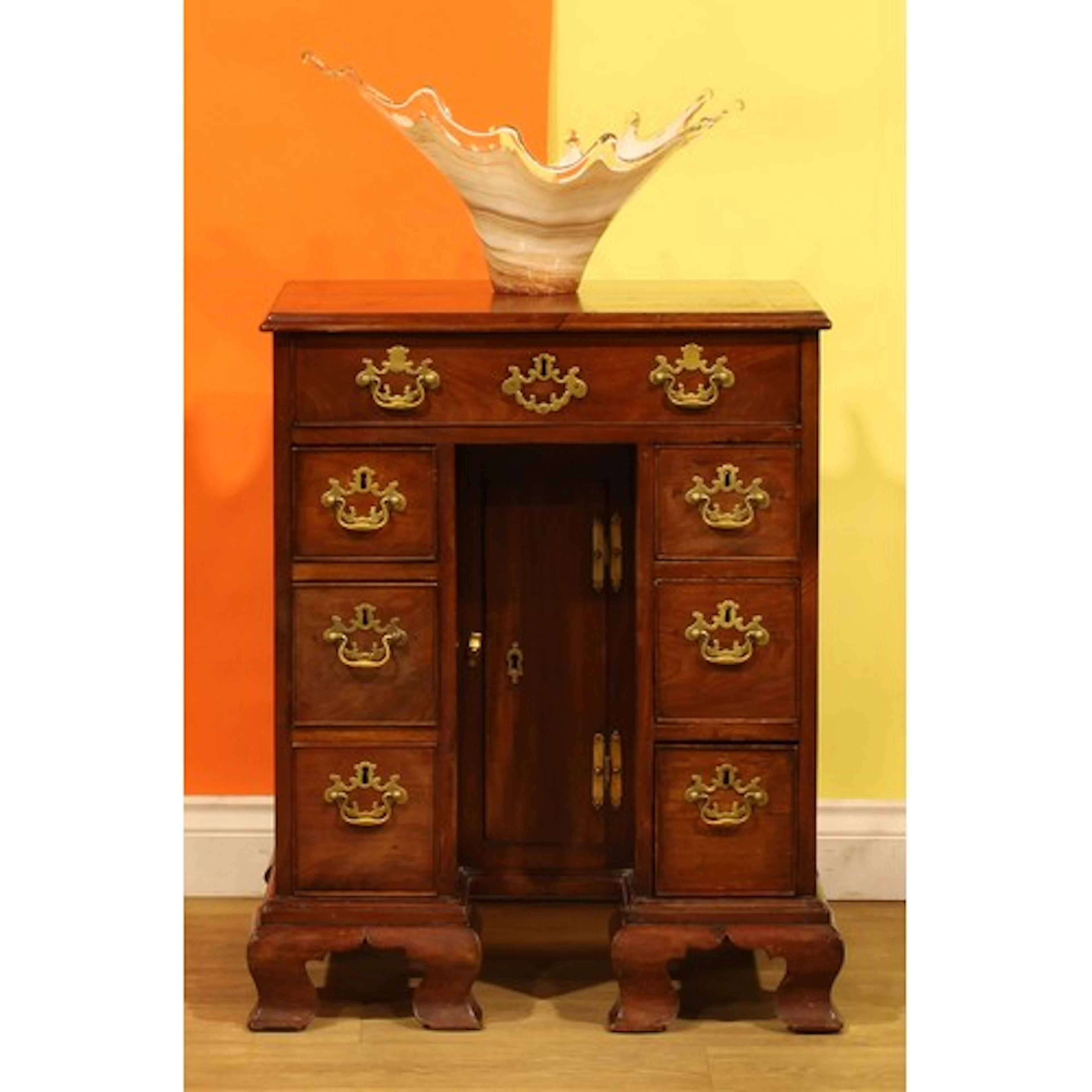 A George III mahogany kneehole desk, of unusually small and ...