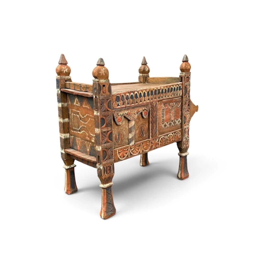 AN INDIAN PAINTED AND CARVED WOODEN CHEST The central compar...