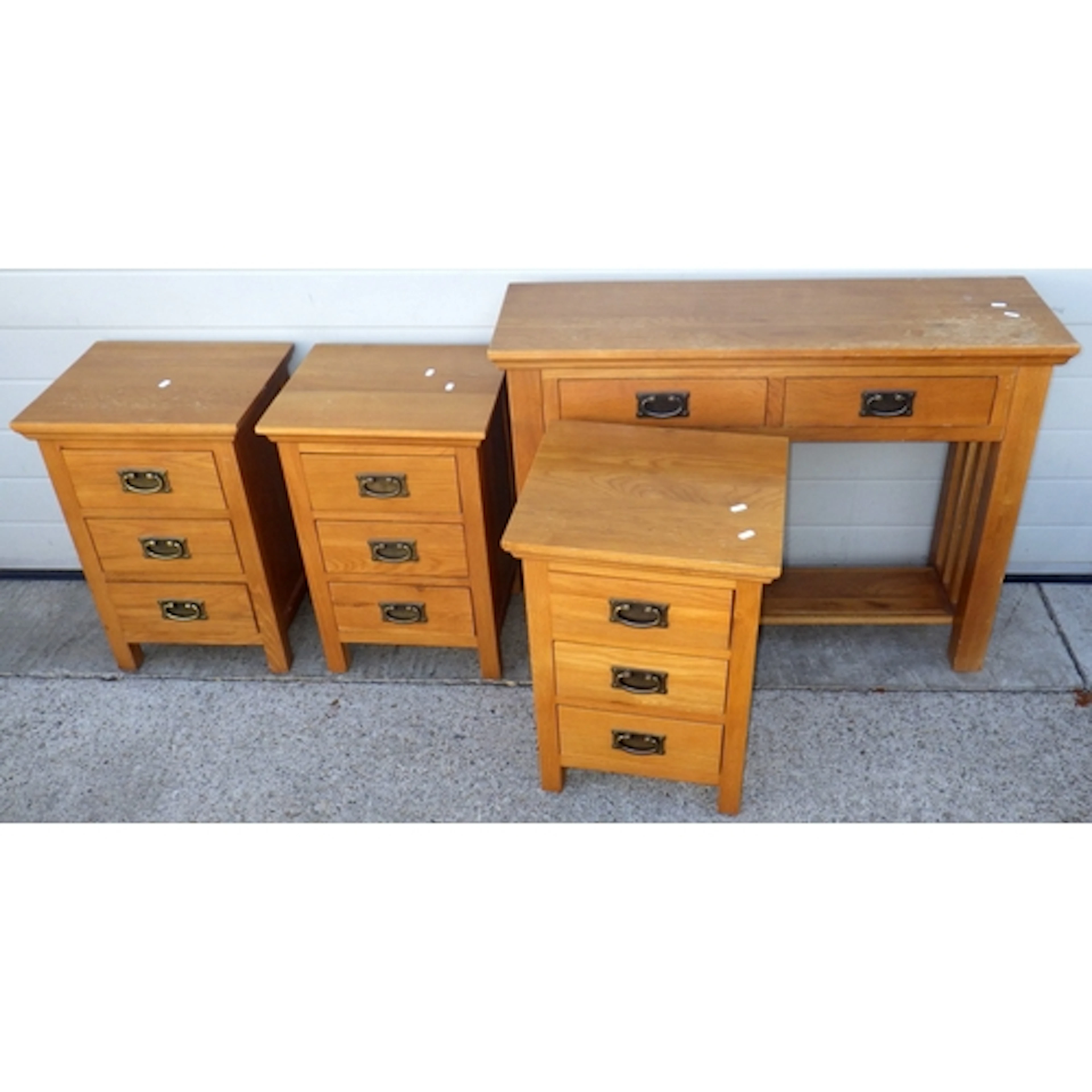 A modern oak side table, marks and three matching bedside ch...