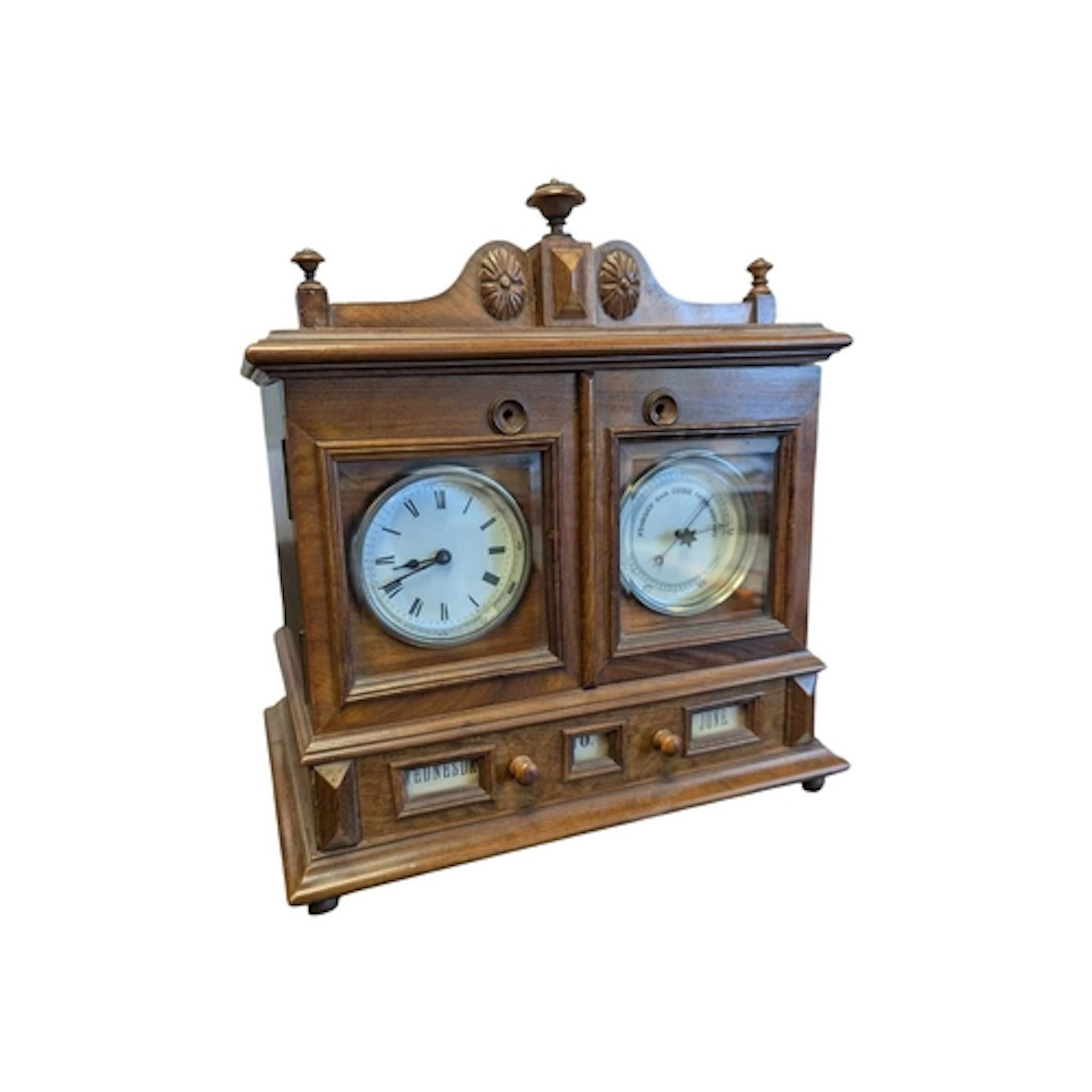 A carved walnut desk clock / barometer compendium with da...